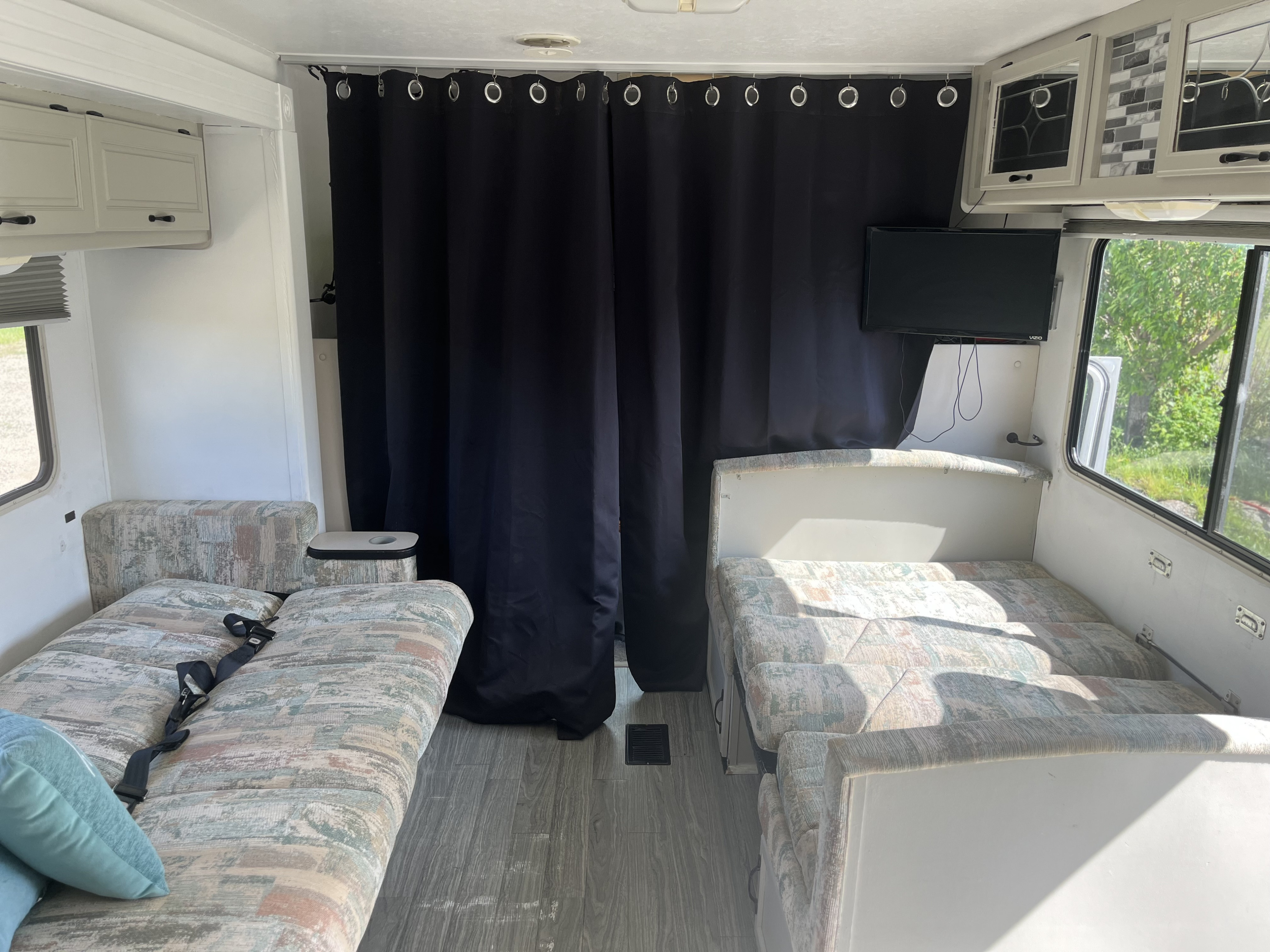 The couch and dining table folded into beds . Thor Motor Coach Chateau 1999