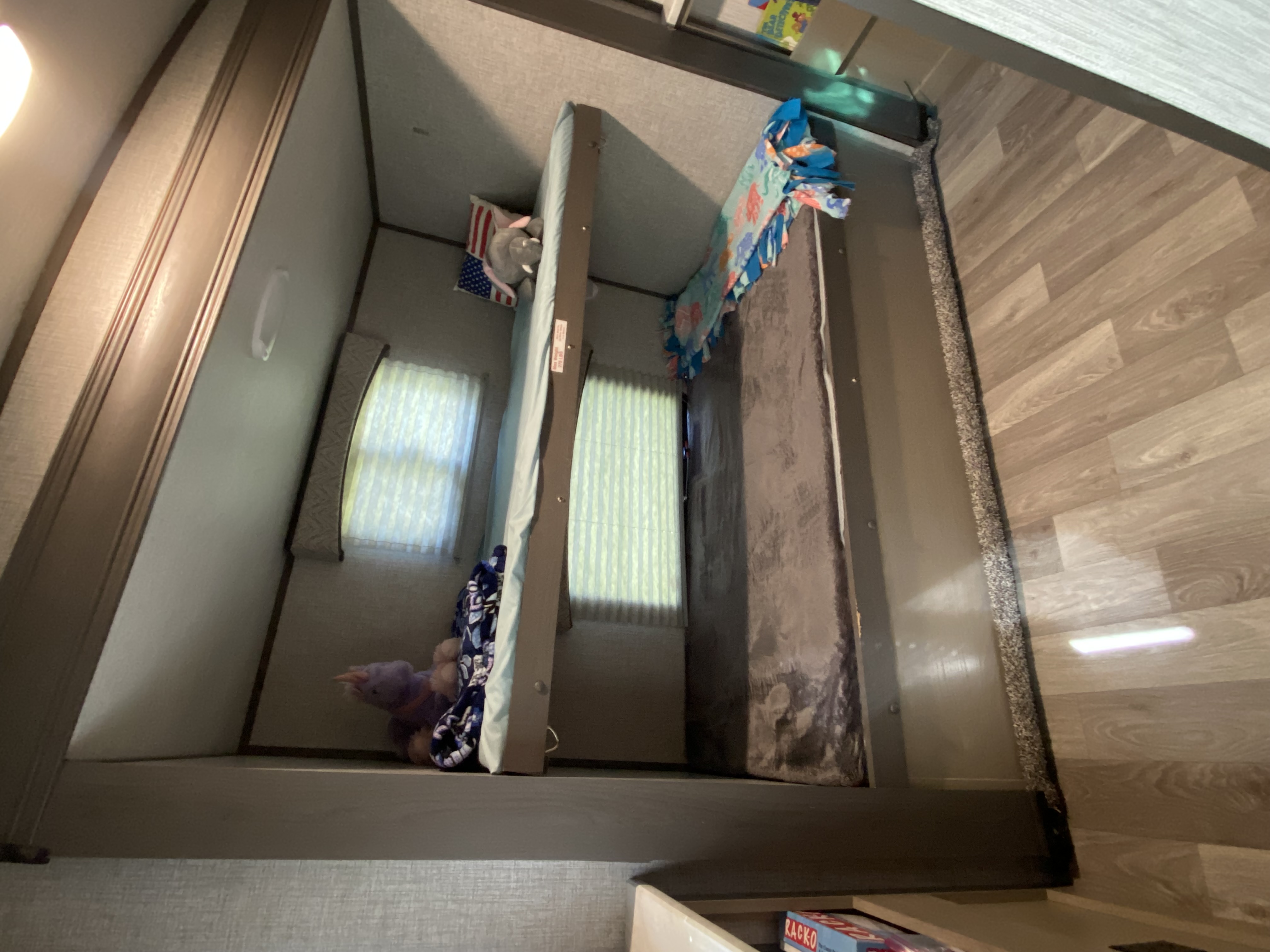 The kids bunkroom. Under the bottom bunk is storage to hold everything for a cleaner room during the trip. Games, books and coloring included as well.. Heartland RVs Sundance Ultra Lite 2021