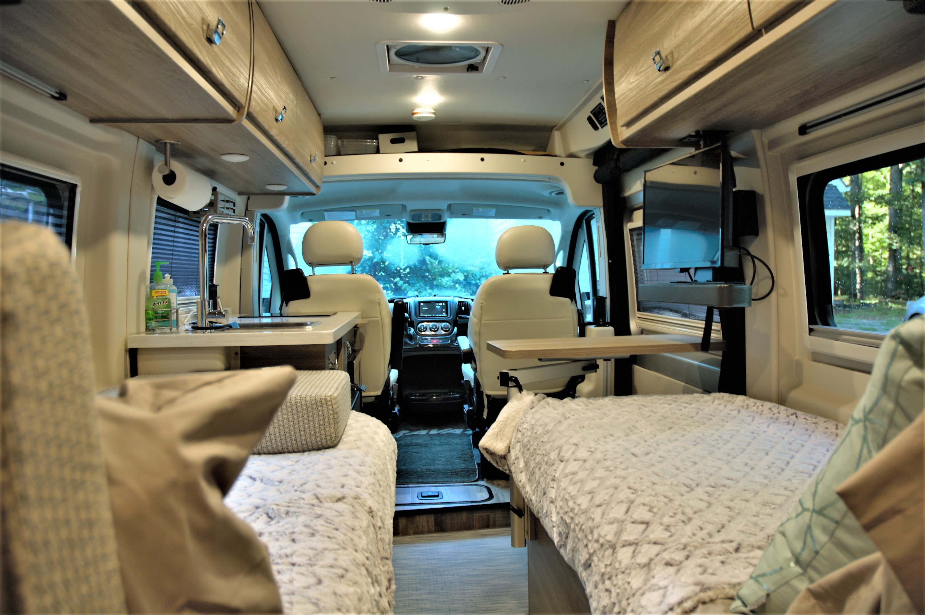 A view from sleeping quarters to the front of the van.. Winnebago Travato 2022