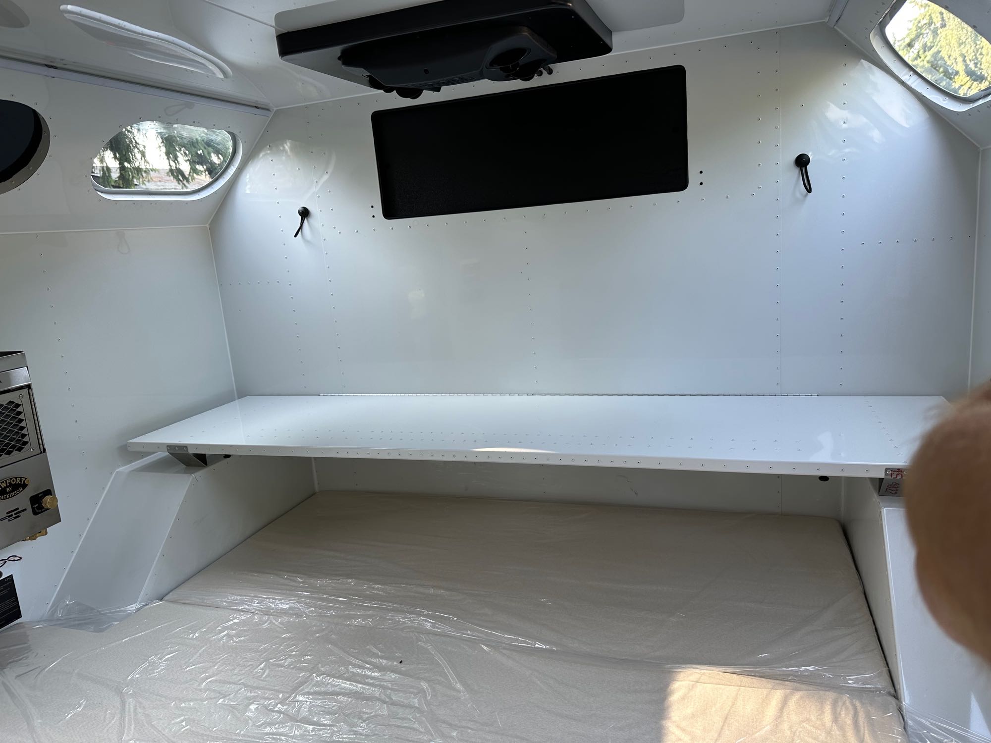 RV rental: Clean white camper interior with new bed, overhead shelf, and windows. Perfect for travel adventures.. Mammoth Overland Mammoth HV 2023