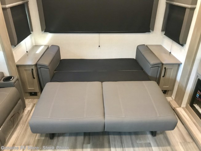RV rental: versatile sofa bed shown partially extended, providing flexible sleeping space in this modern RV interior.. Grand Design Reflection 2020