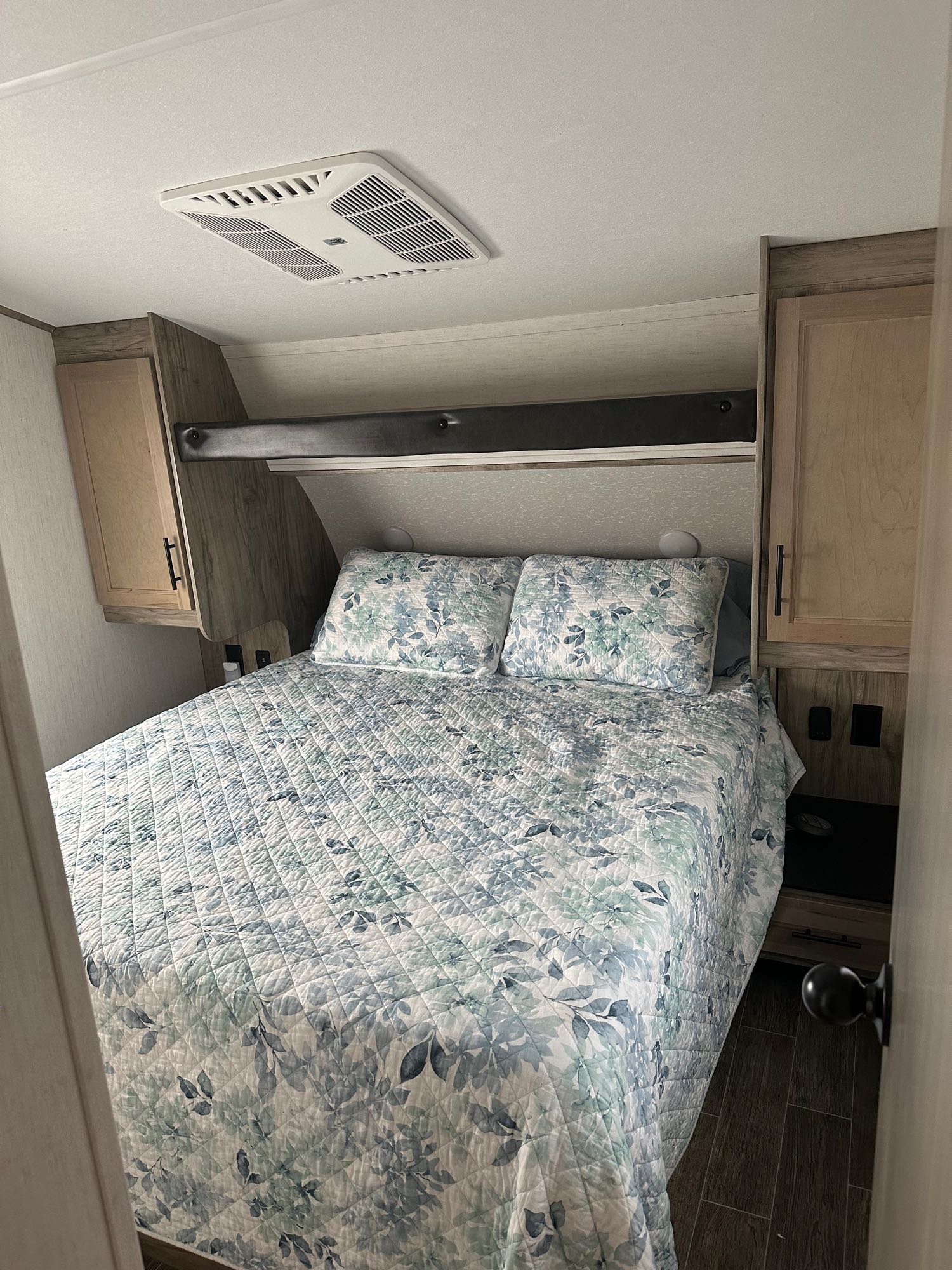 Queen master bed with under storage, closet and cabinet space . Forest River Cherokee Arctic Wolf 2022