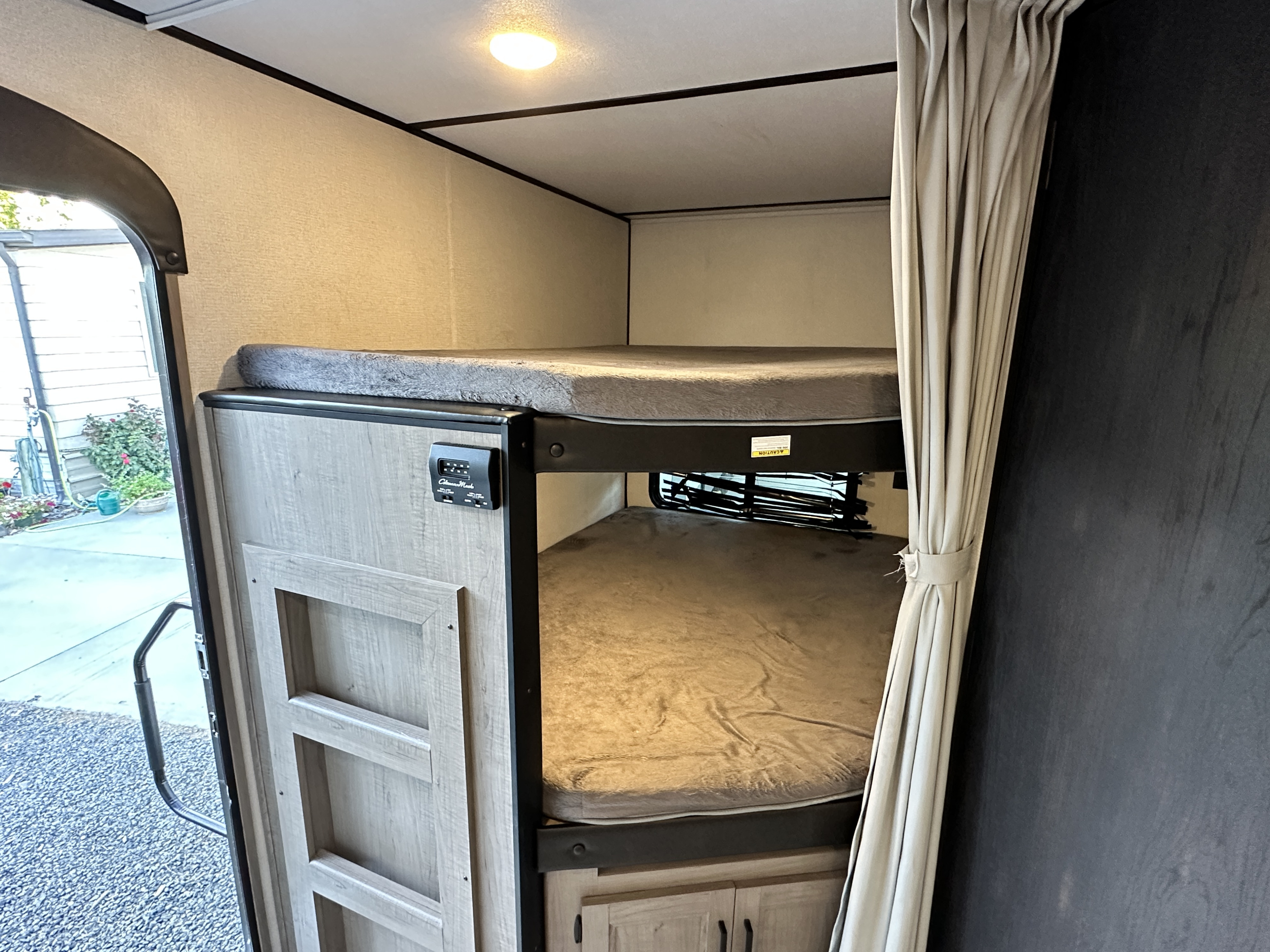 This RV rental offers a comfortable interior with built-in bunk beds and storage, great for families.. Keystone Hideout 2020