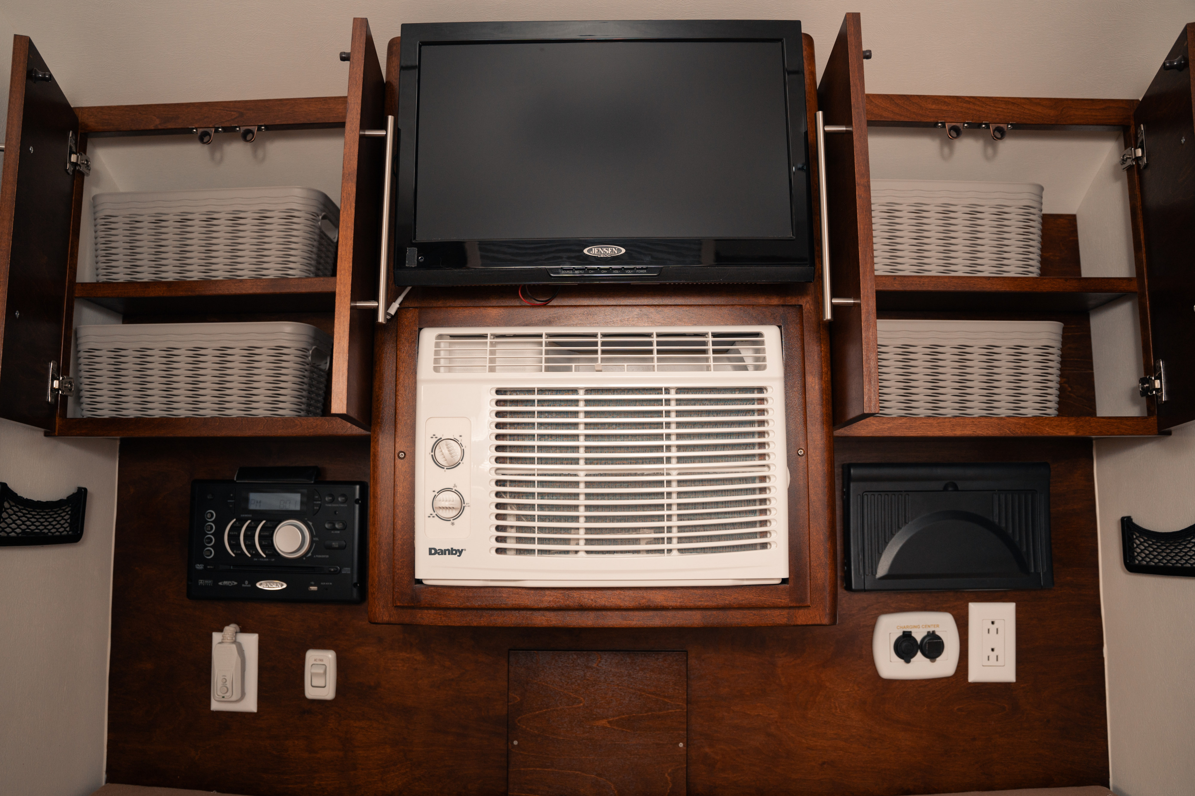 This RV rental offers a well-equipped interior: TV, AC, stereo, and storage baskets in custom cabinets for comfort.. nuCamp T@G 2017