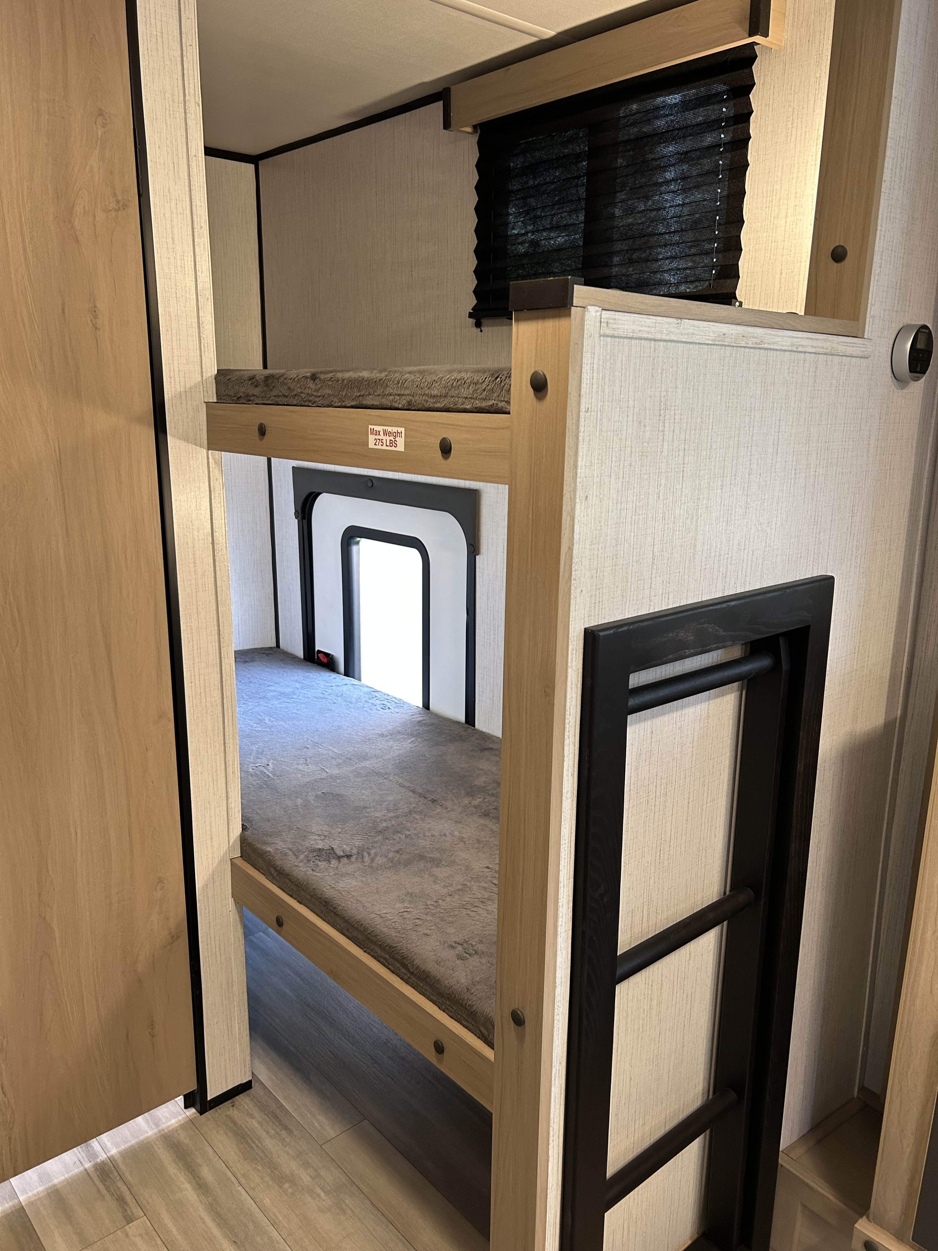 RV rental bunk beds: two cozy tiers with a ladder. The top bunk has a 275 LBS max weight limit.. Cruiser RV Hitch 2022