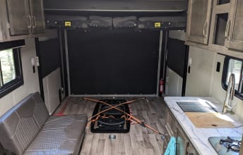 Bunks up for storage. The two queen beds drop down. The lower queen can be lowered alone and also converts to a booth seating area.. Jayco Octane Super Lite Toy Hauler 2020