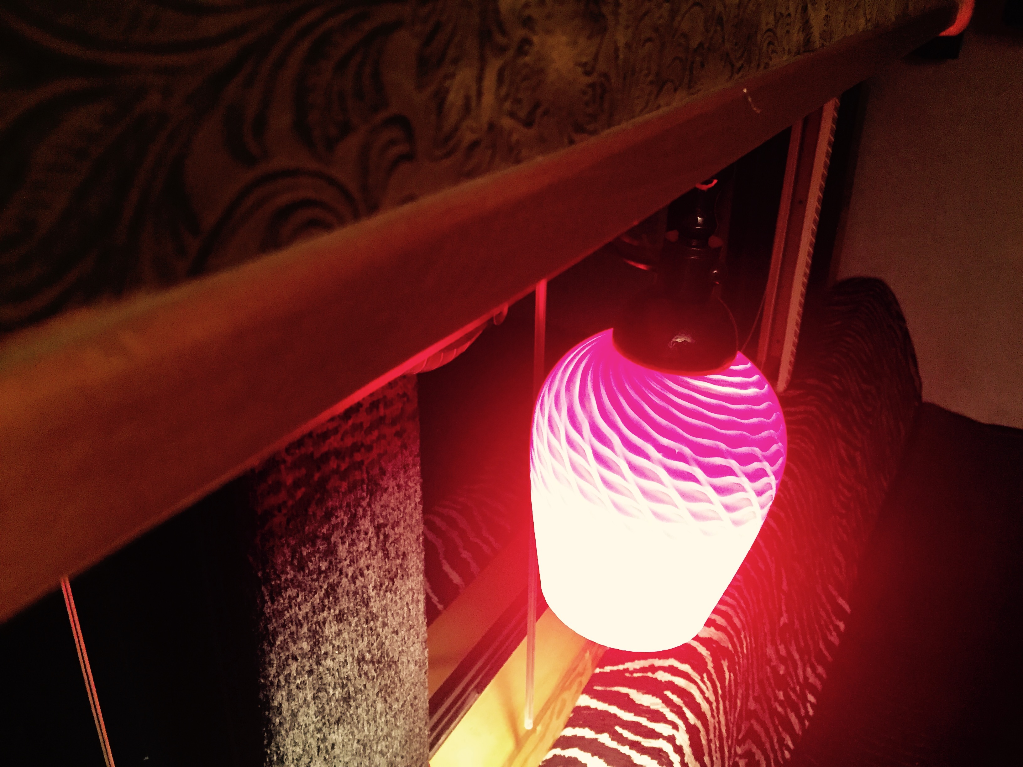 Cozy RV rental interior featuring a unique pink spiral lamp and patterned upholstery, creating a warm ambiance.. Eagle International Tour Bus /w Driver 1985