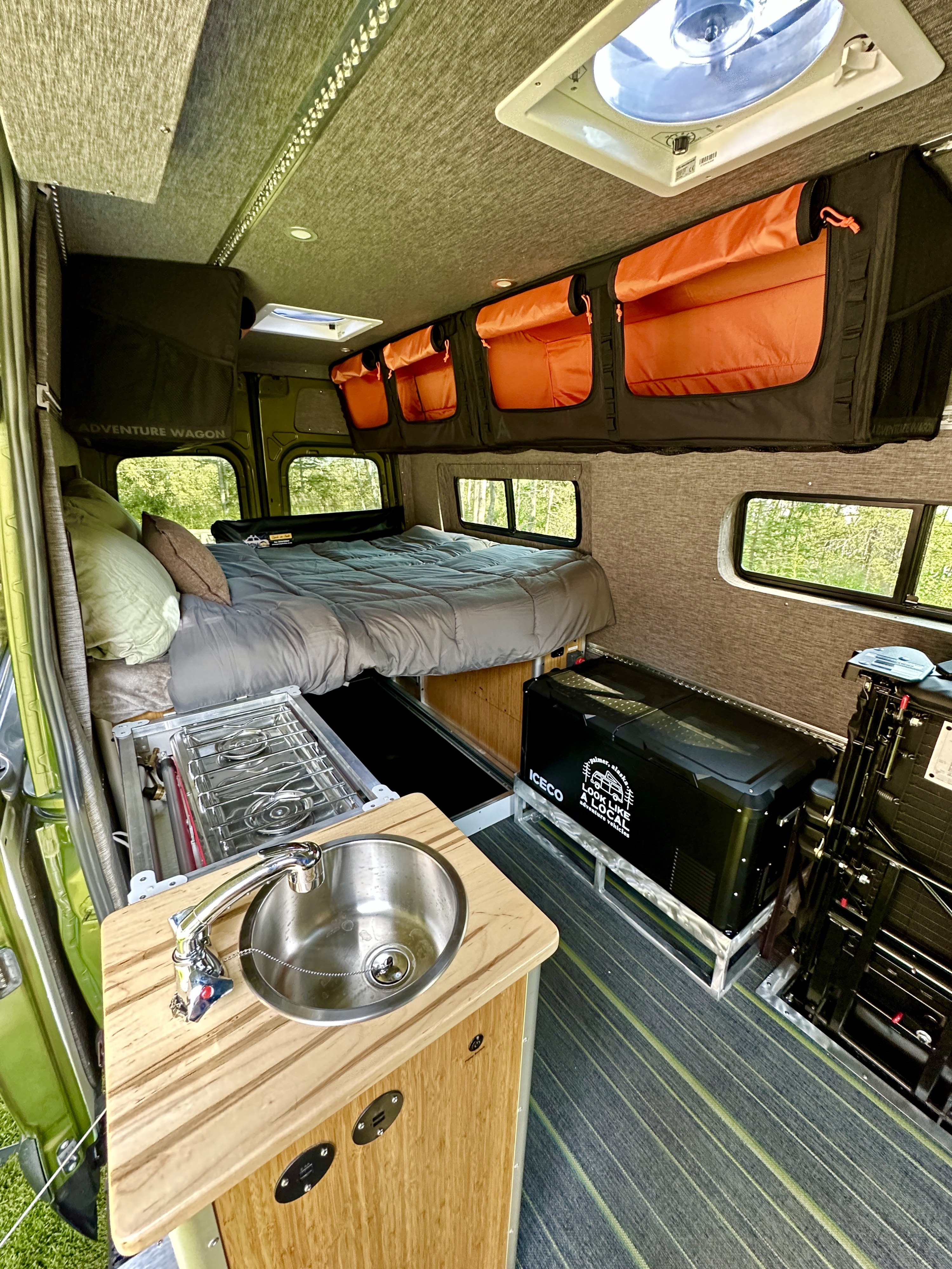 Adventure Wagon RV rental: comfy bed, compact kitchen w/ sink, stove & cooler. Ready for travel.. Freightliner Sprinter 2019