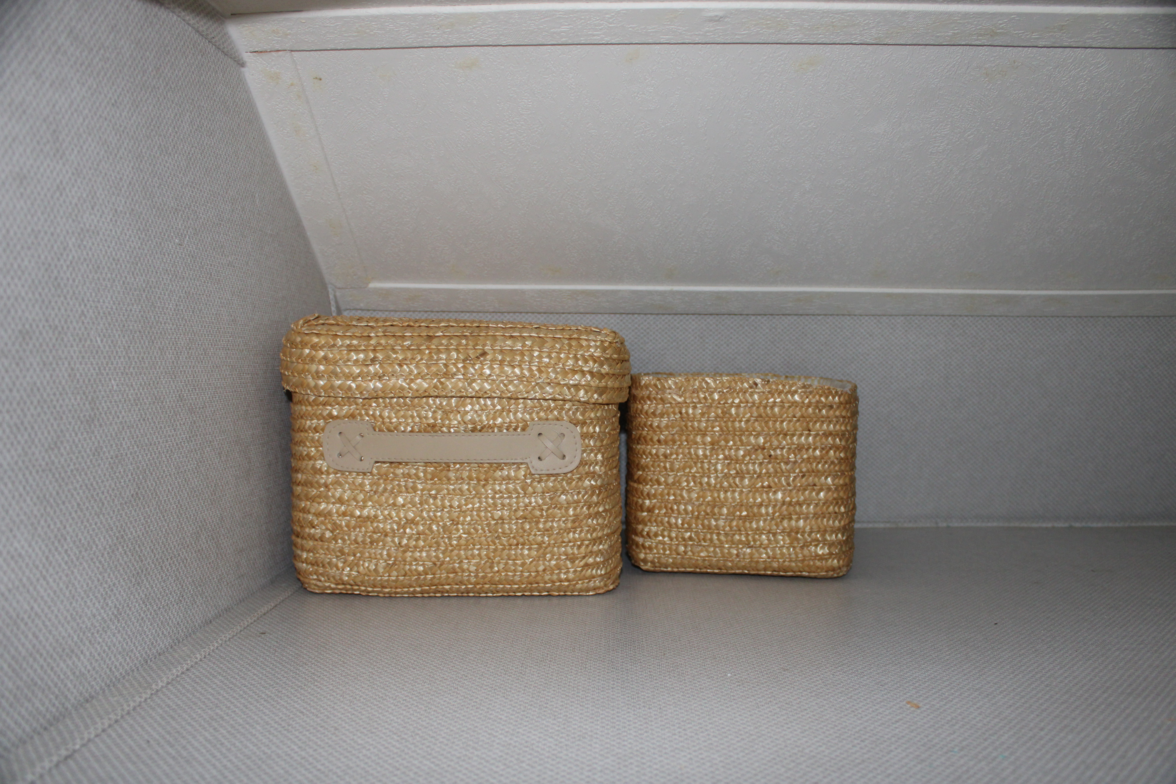 Compact RV rental interior with two woven storage baskets, ideal for organizing small items on the go.. Forest River Other 2019