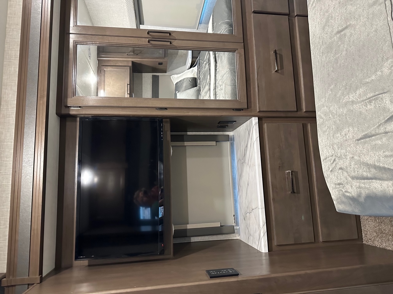 TV, closet, and dresser drawers in bedroom. Thor Hurricane 2022