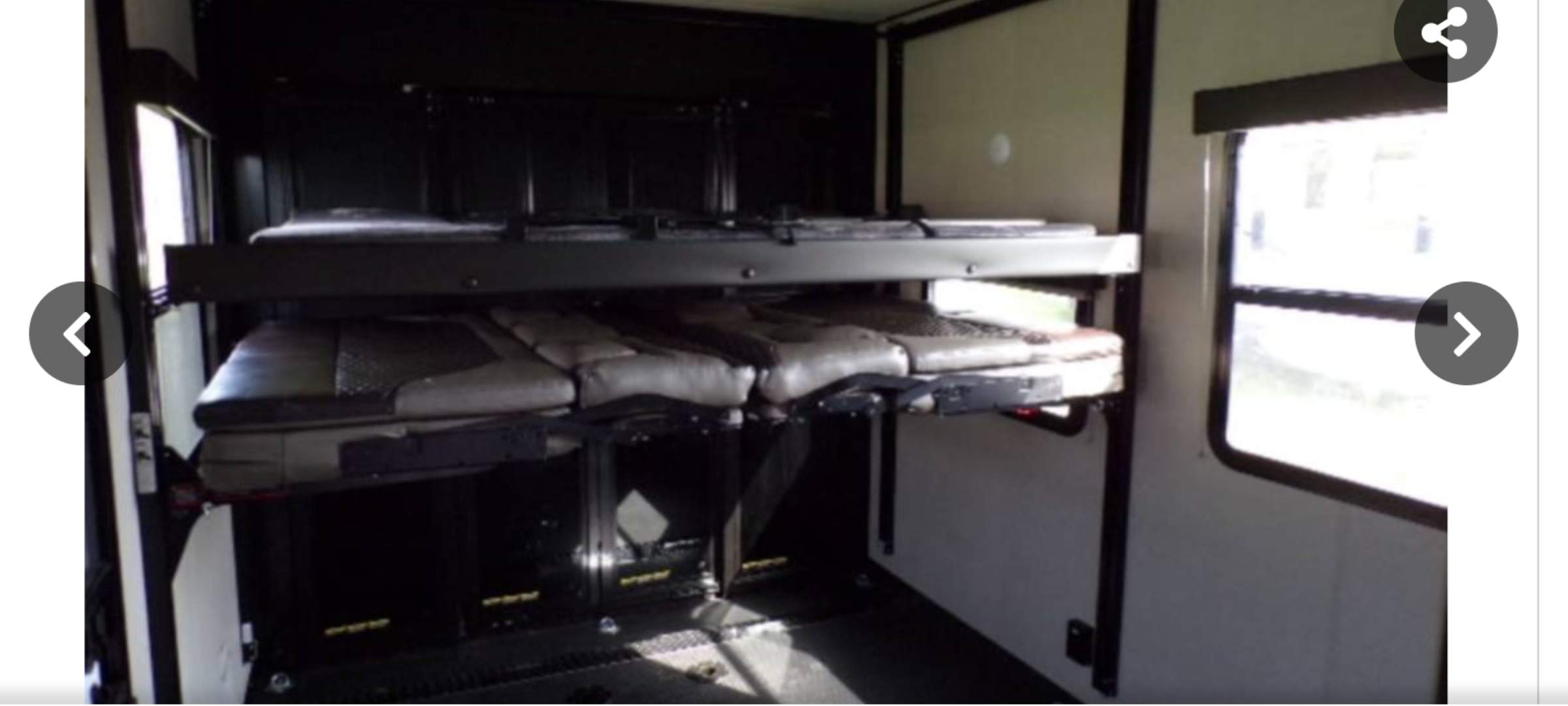 RV rental's adaptable garage area. Features Happijac power bunk/sofa beds for versatile use.. Grand Design Momentum 2022