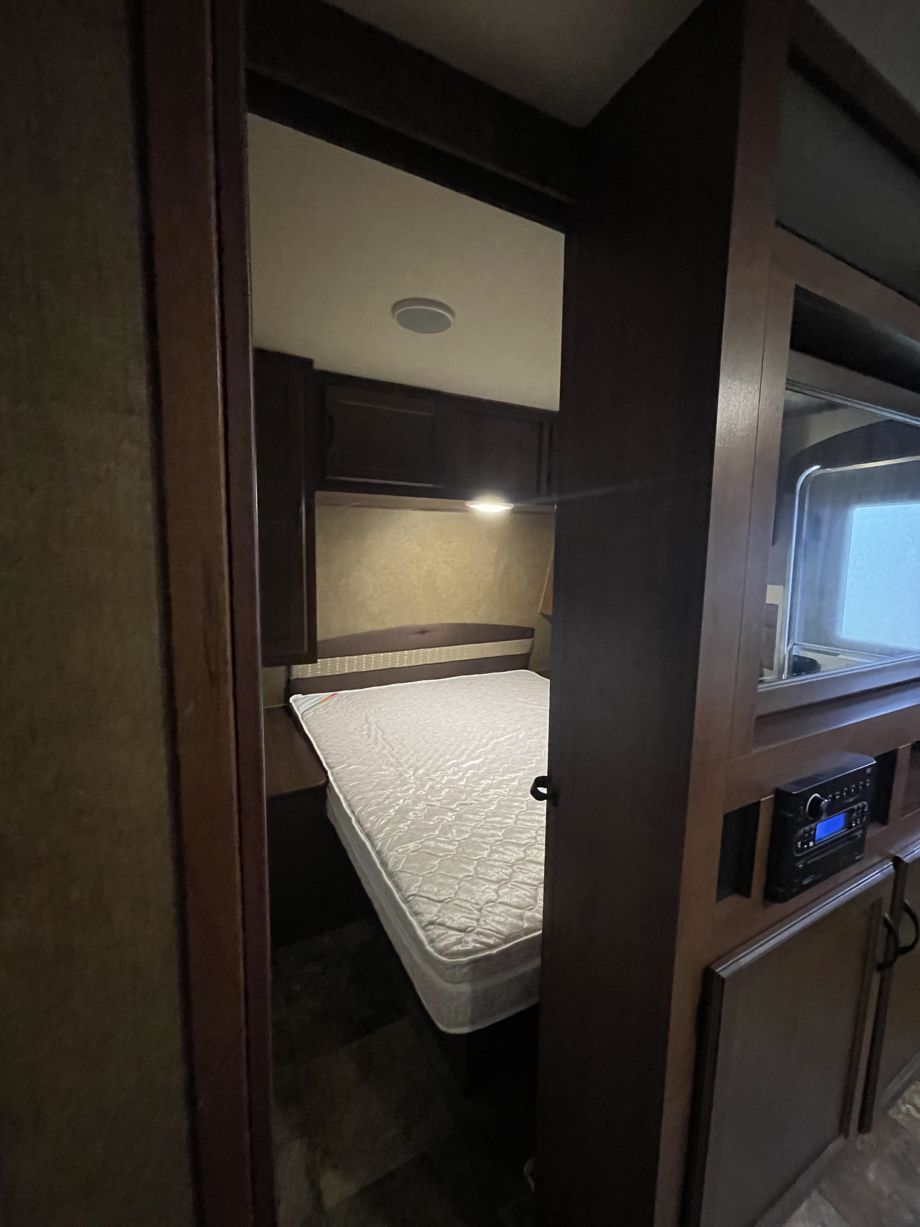 Master bedroom with queen size bed, closet on both sides, storage above and storage underneath. TV and mirror rotate. Dvd player included! . Jayco Jay Flight 2015
