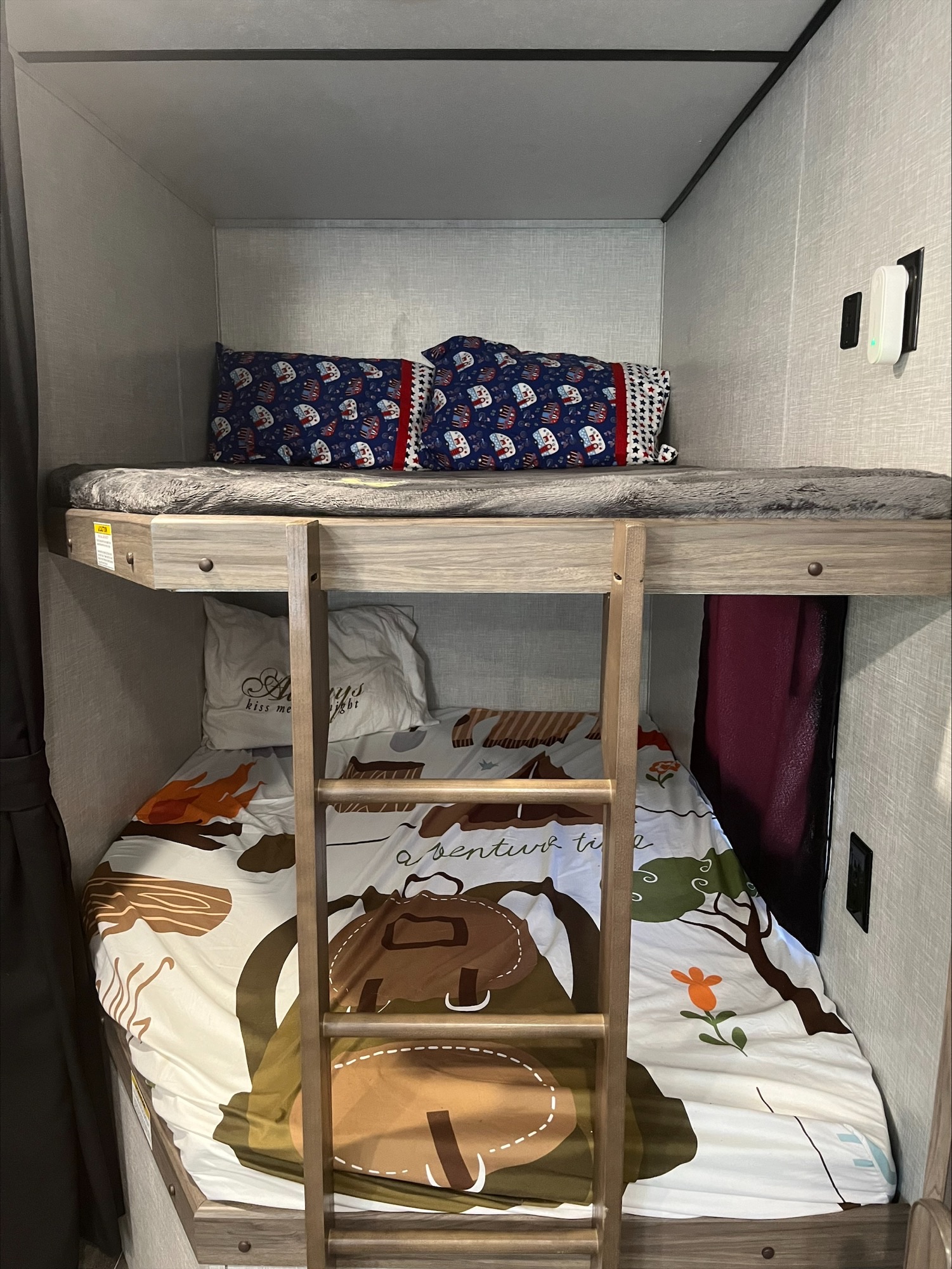 Cozy RV rental bunk beds with themed bedding, ideal for family travel adventures.. Crossroads RV Zinger Lite 2021