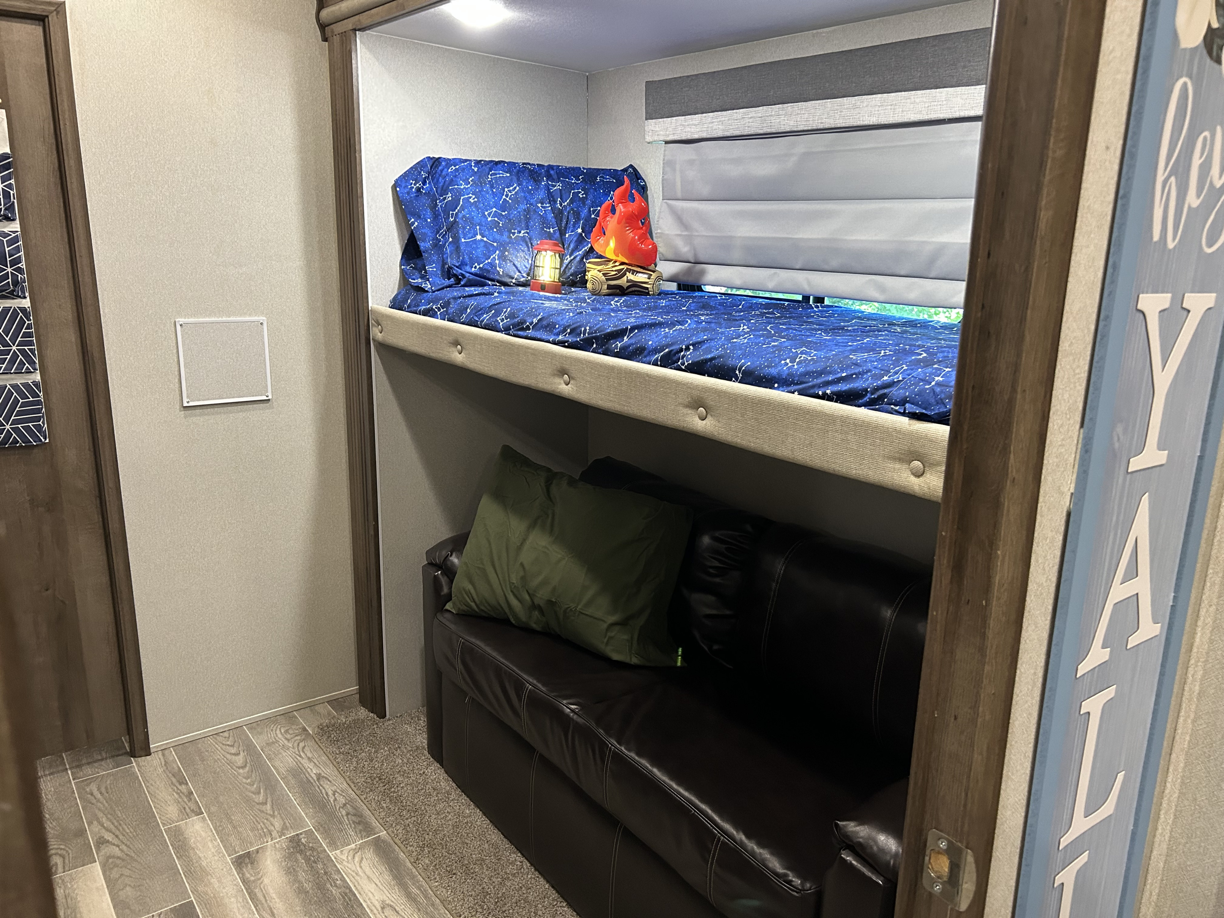 Twin bunk bed with Jack-knife couch that also pulls out into a bed. . Forest River Cardinal Limited 2019