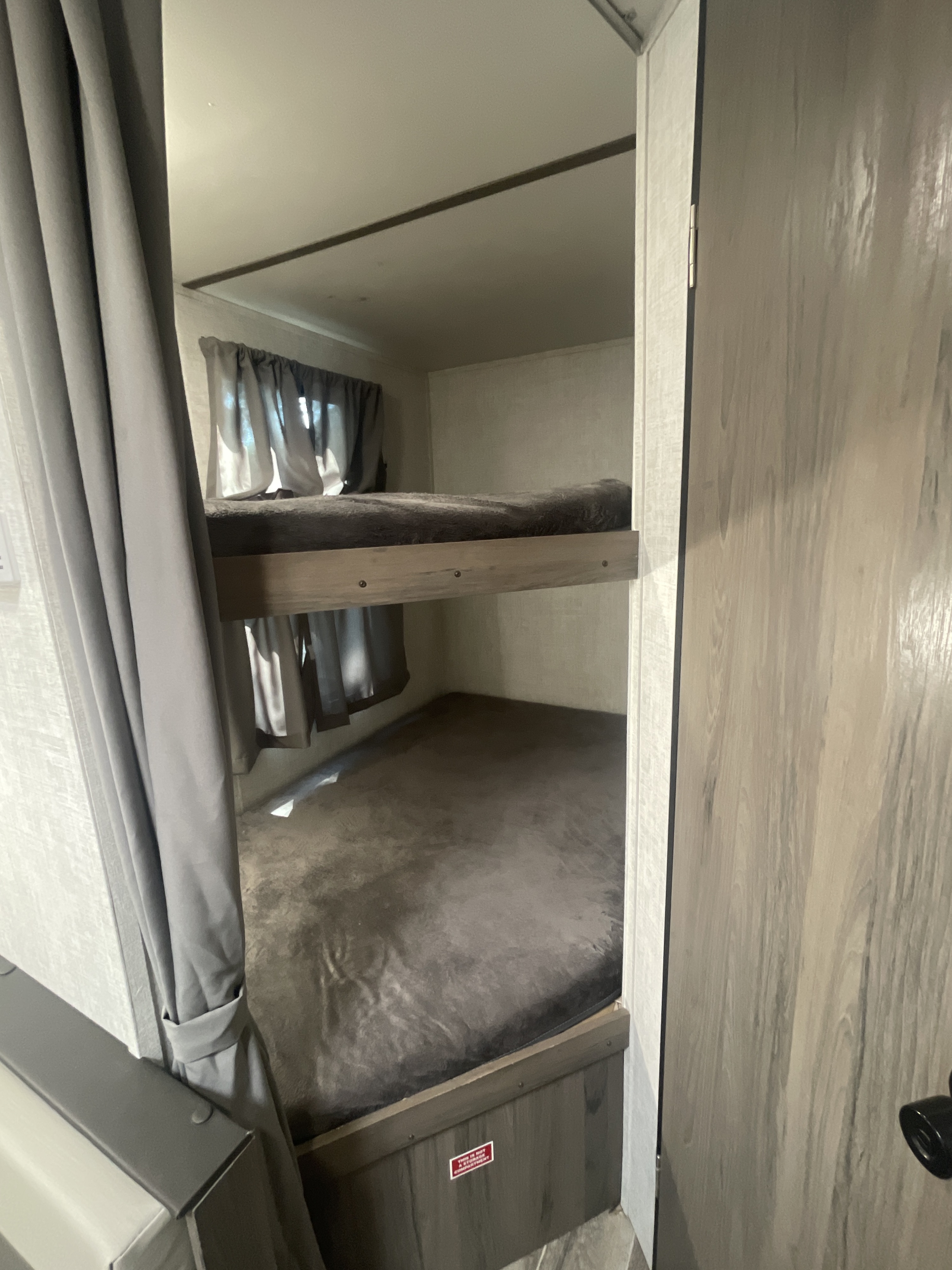 Double bunks - just bring blankets and pillows. Both bunks have a window and light. Gulf Stream Grand River 22MB 2022