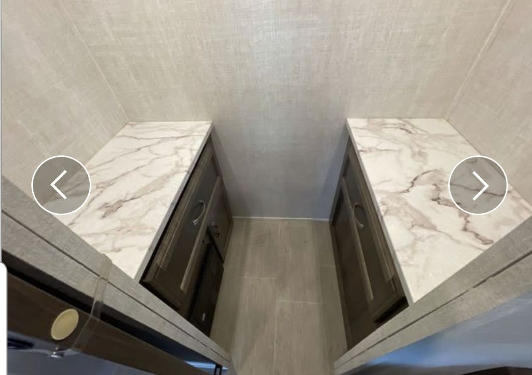 RV rental: Modern interior featuring twin marble-look countertops over storage cabinets along a central aisle.. Gulf Stream Conquest 2021