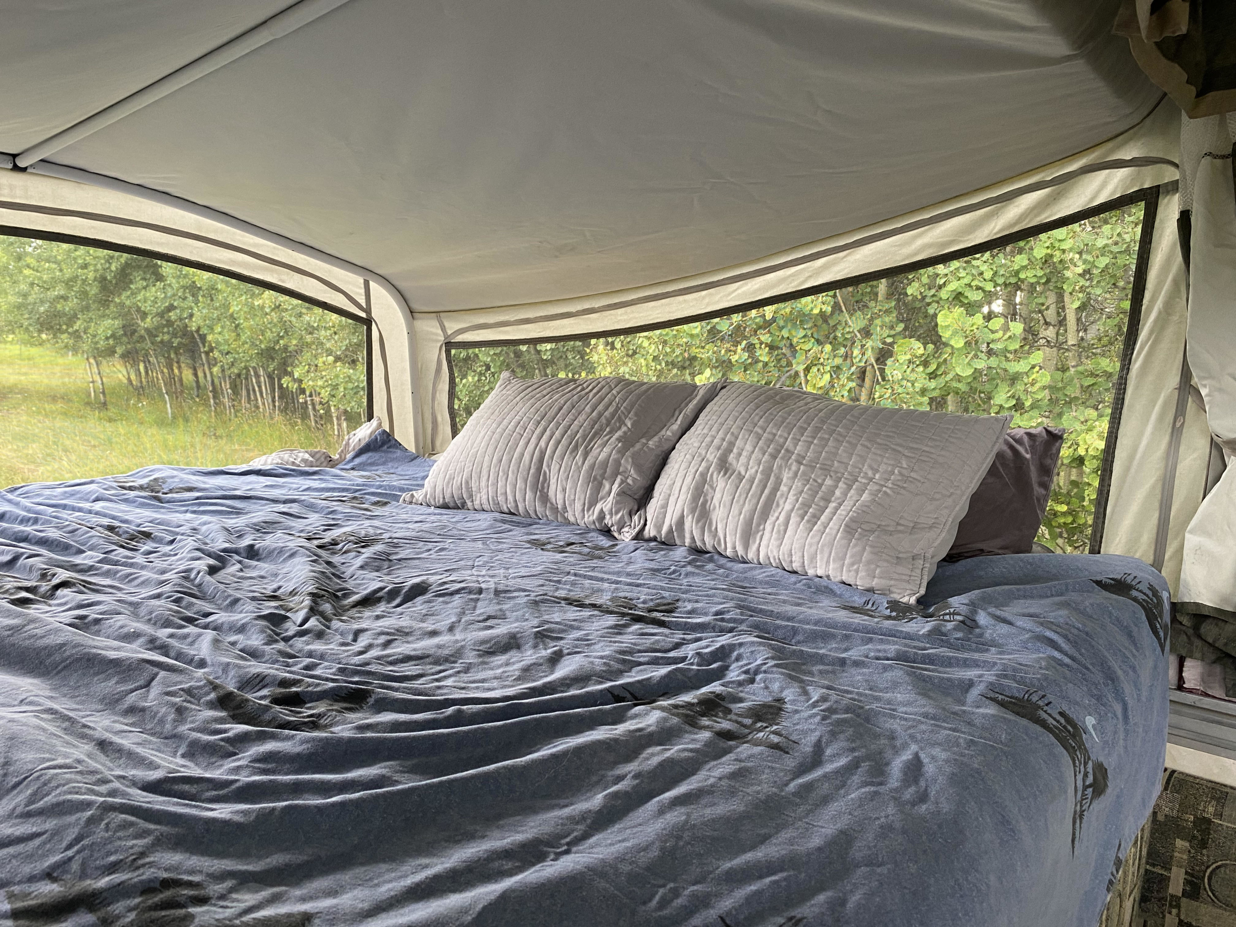 Another comfy King size bed with flannel duvet and bamboo mattress topper. Forest River sequoia pop up camper 2000