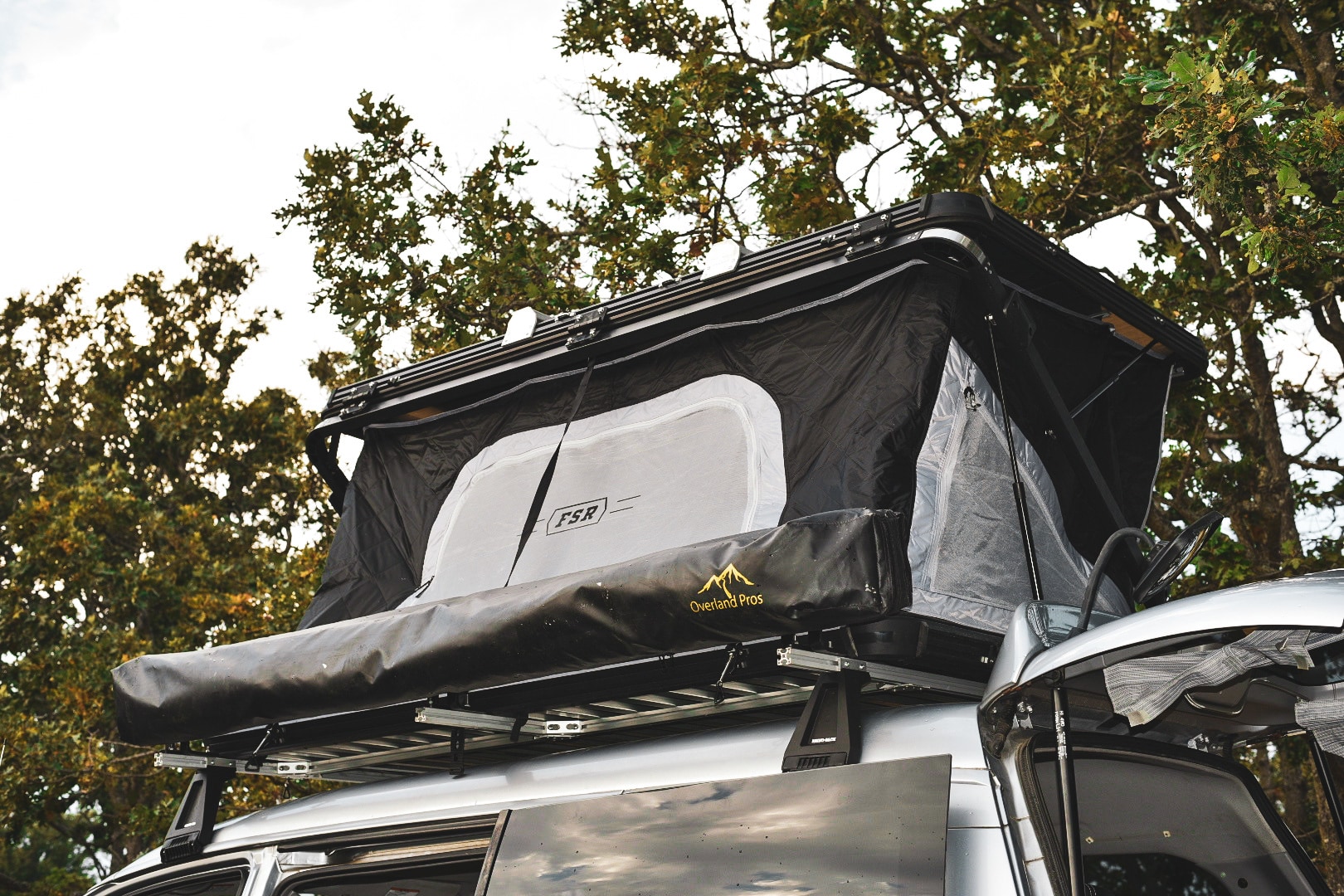 RV rental with deployed FSR rooftop tent & Overland Pros awning. Ready for overland vehicle camping.. Mitsubishi Delica 2005