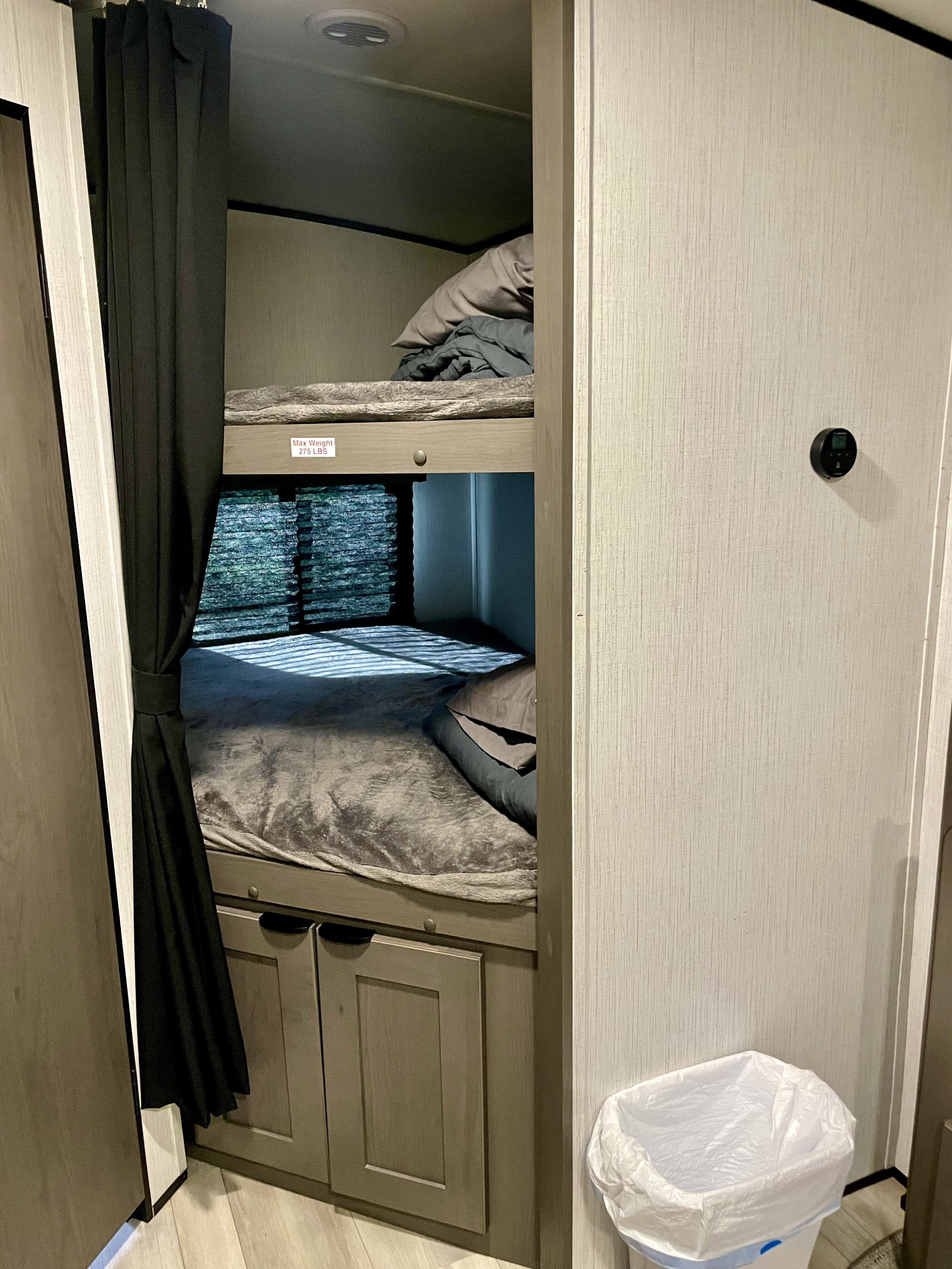 RV rental bunk beds feature cozy bedding, privacy curtains, lower storage cabinets, and a 275lb weight limit per bunk.. Cruiser RV MPG Ultra Lite 2022