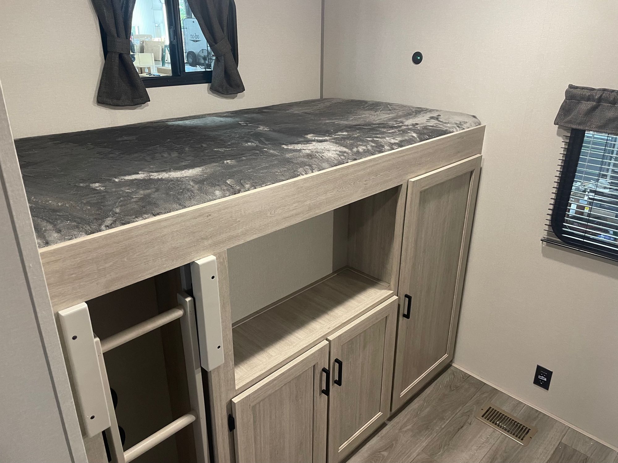 RV rental features a bunk bed with ladder, plus built-in storage. Designed for travel efficiency.. Coachman Catalina, Legacy edition 343BHTS 2024