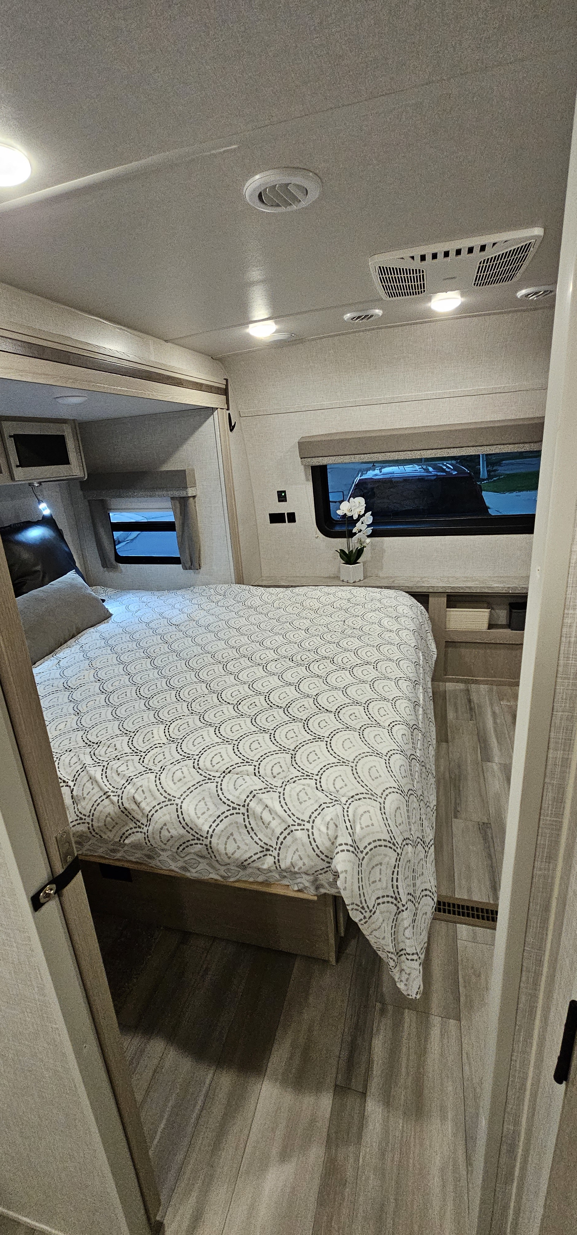 Looking into the primary bedroom w/ Kind bed. (door shown in open position) Door closes for complete privacy.. Forest River Flagstaff Super Lite 2022