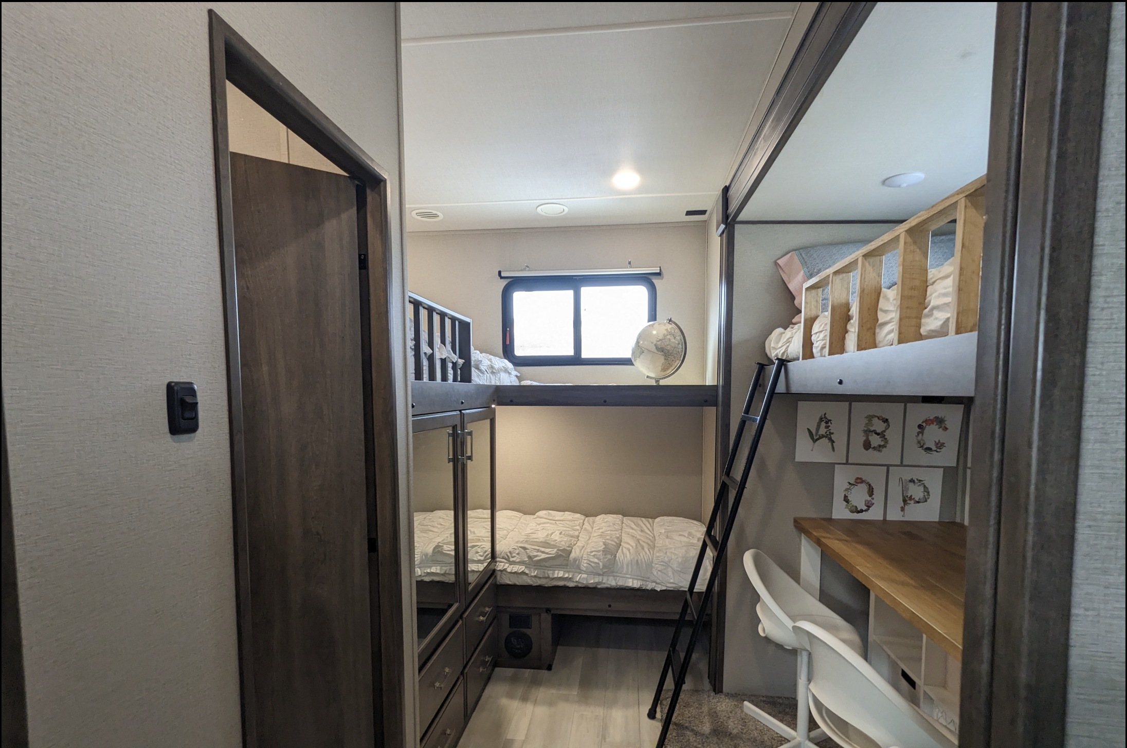 Explore this RV rental with its cleverly designed bunk beds and a functional desk, offering space for family adventures.. Grand Design 3740BH 2021
