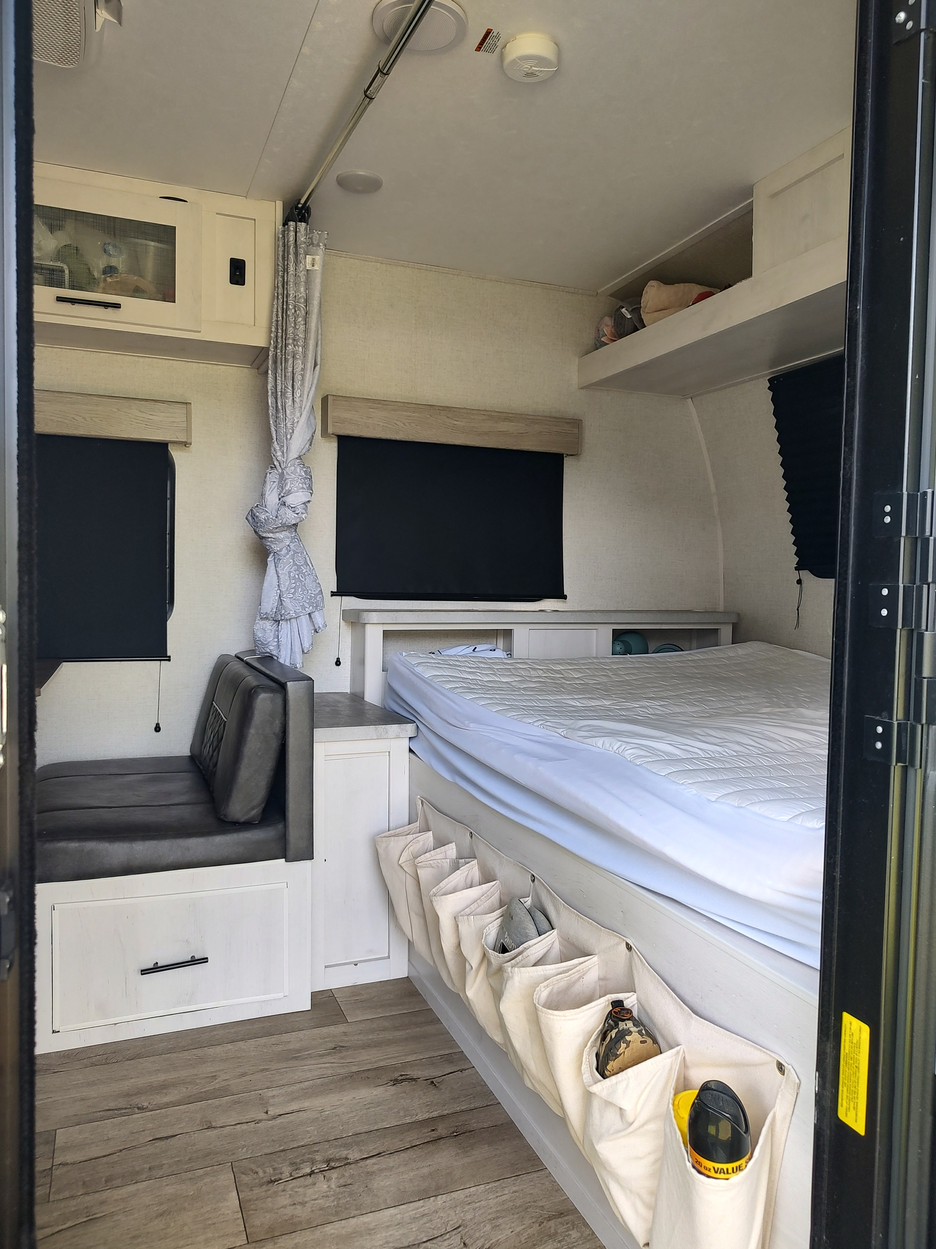 RV rental: A well-organized interior with a comfortable bed, dinette, and clever storage for a cozy travel experience.. Dutchmen Coleman Rubicon 2021