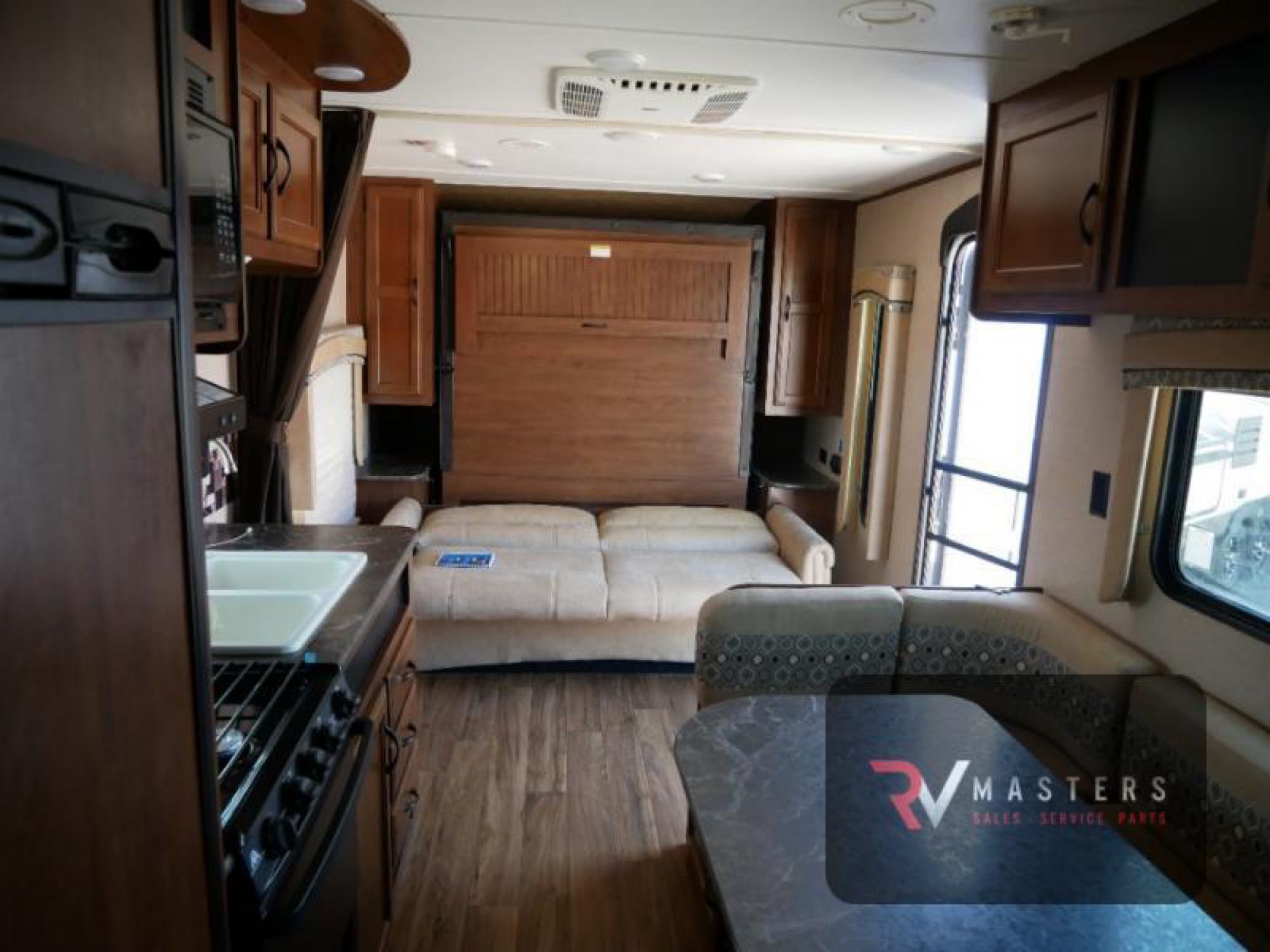 This RV rental's interior boasts a kitchen, fold-down bed, and dinette, offering comfort and convenience on the road.. Jayco Jay Flight 2016