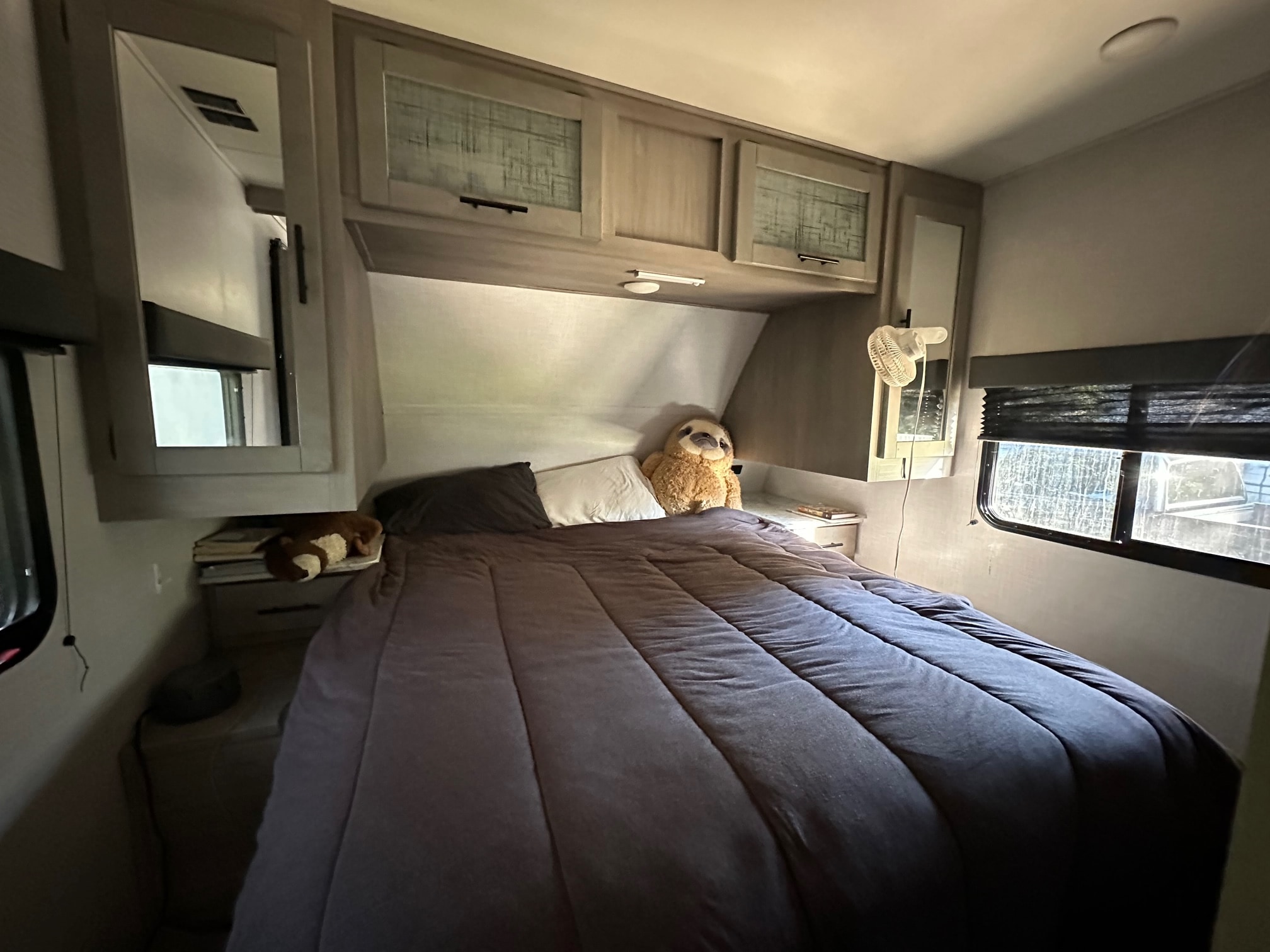 Master bedroom with queen size bed and ample storage. Dutchmen Coleman Lantern 2022