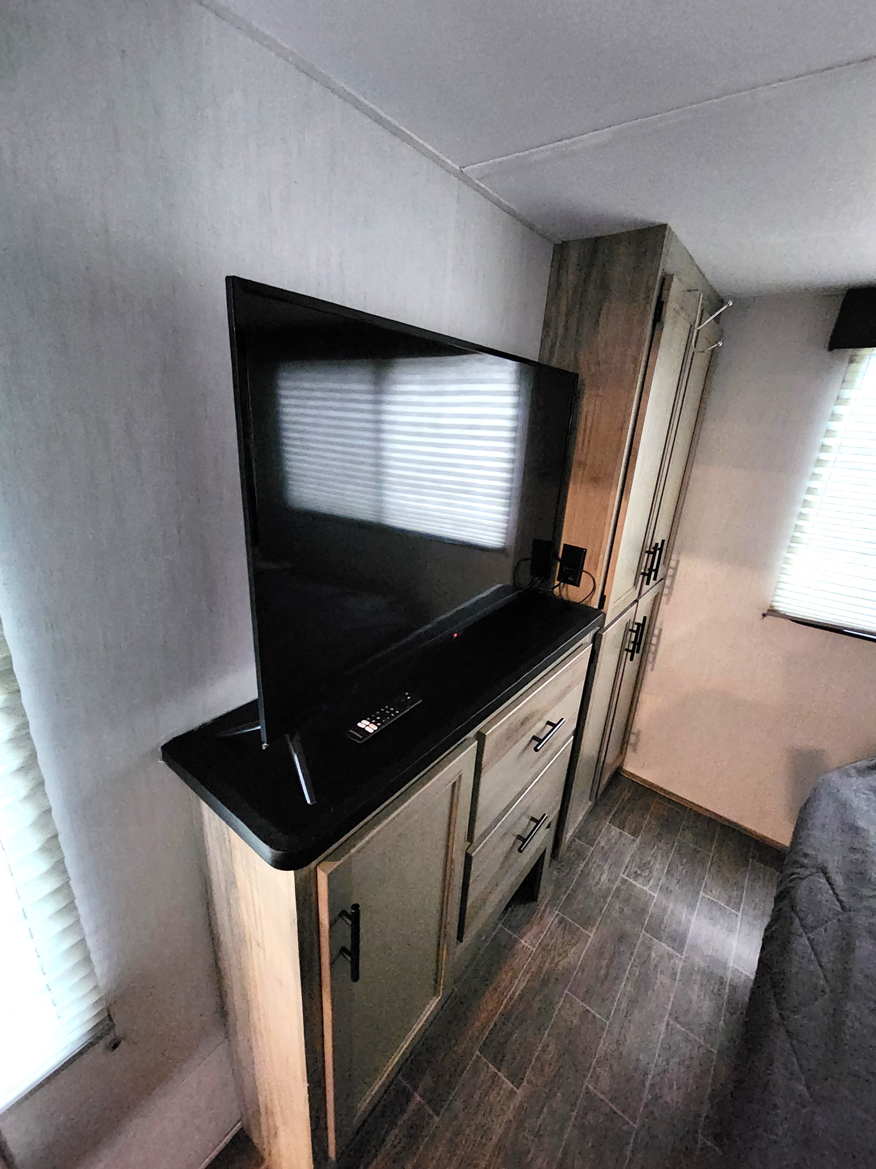 Smart TV in primary bedroom. Forest River Cherokee Arctic Wolf 2022