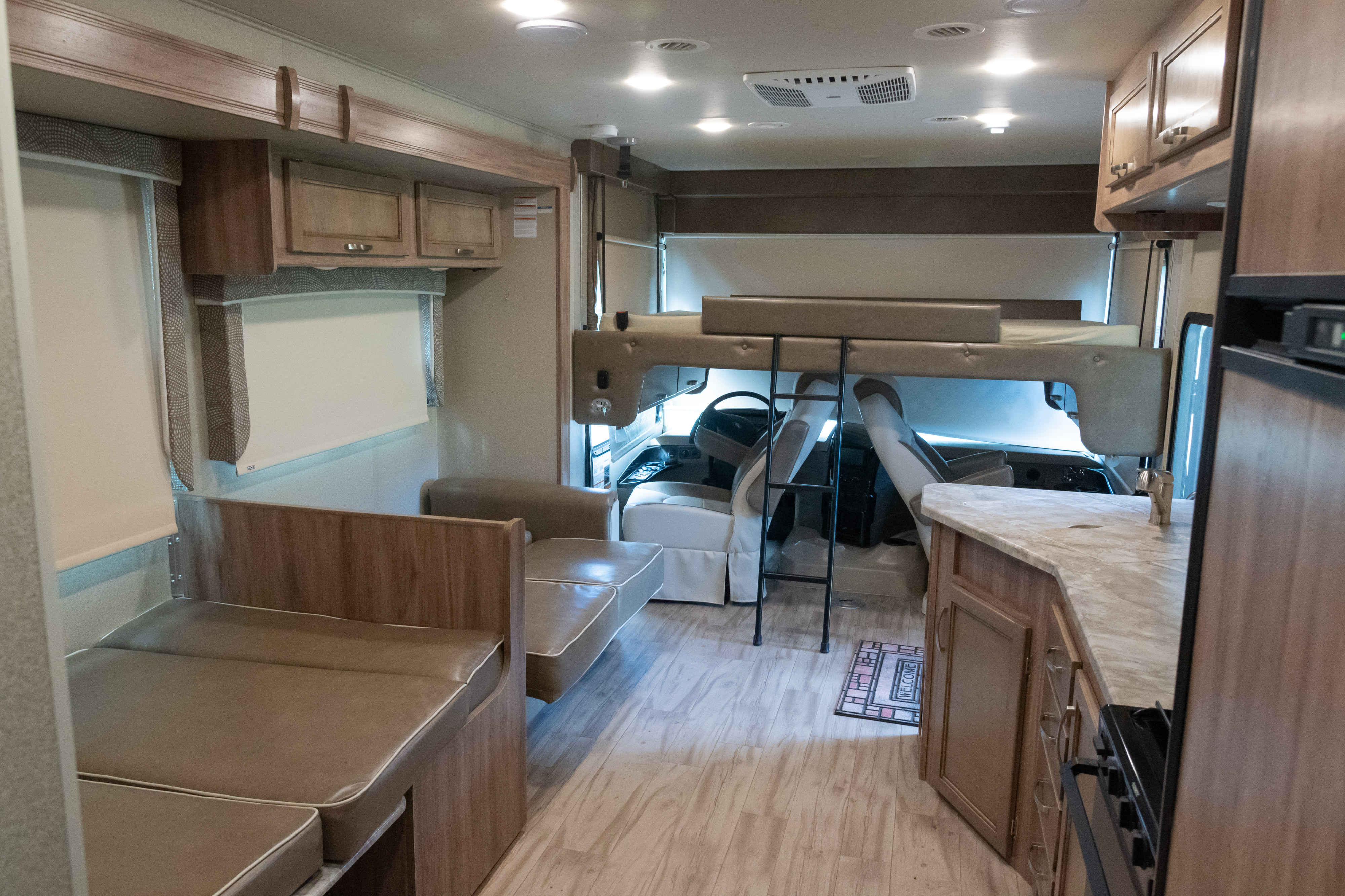 Overhead lowers for a spacious bed holding up to 700 lbs. Entegra Coach Vision 2019