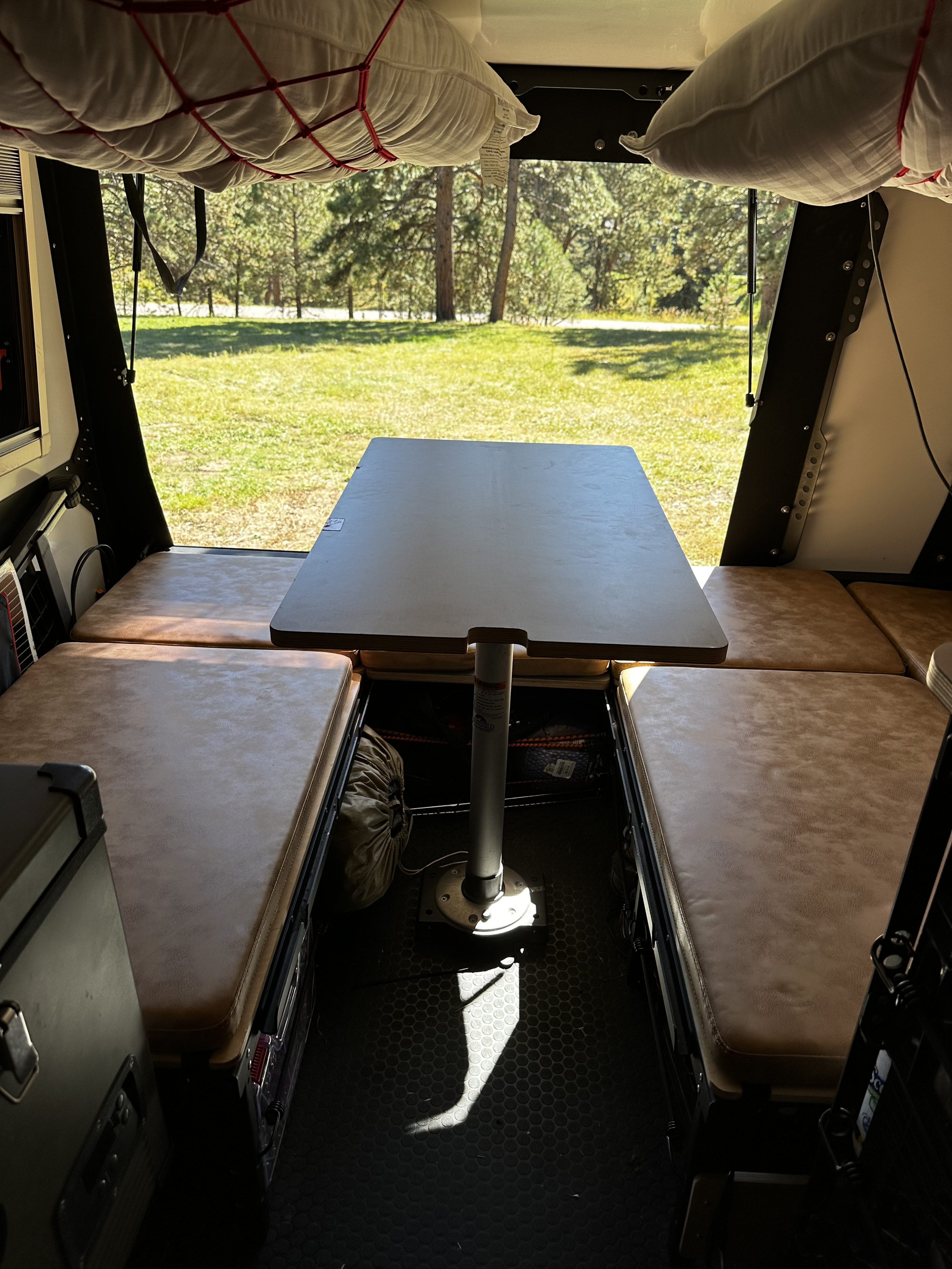 Rear double bed slize sleep area converts to a dinette. . TAXA TAXA Trailer 2021