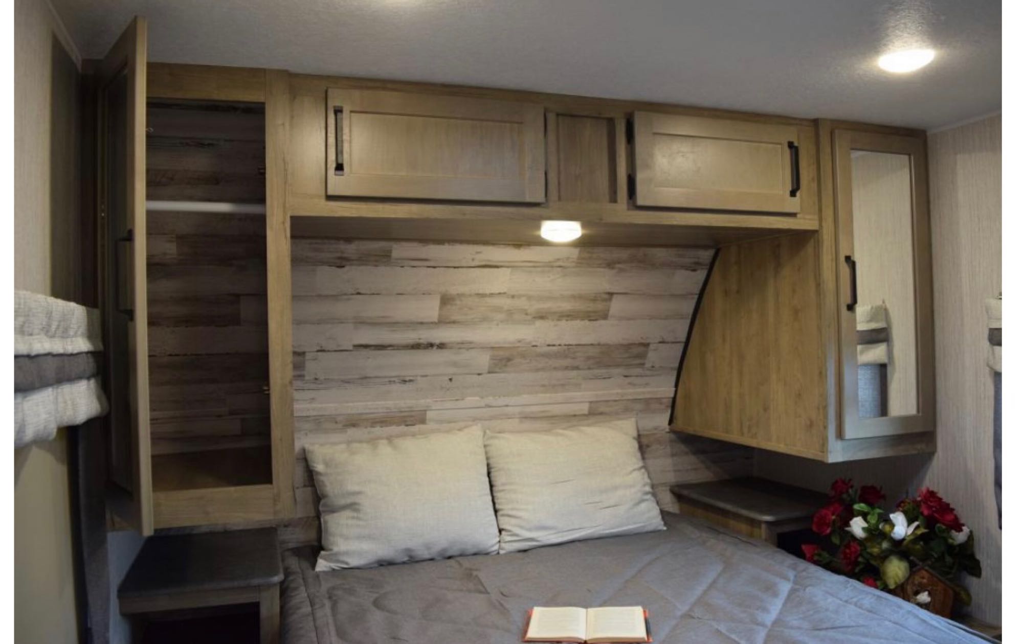 Cozy RV rental bedroom with spacious storage: cabinets, open closet, nightstands, and comfy bed for your travels.. Puma Palomino 2021