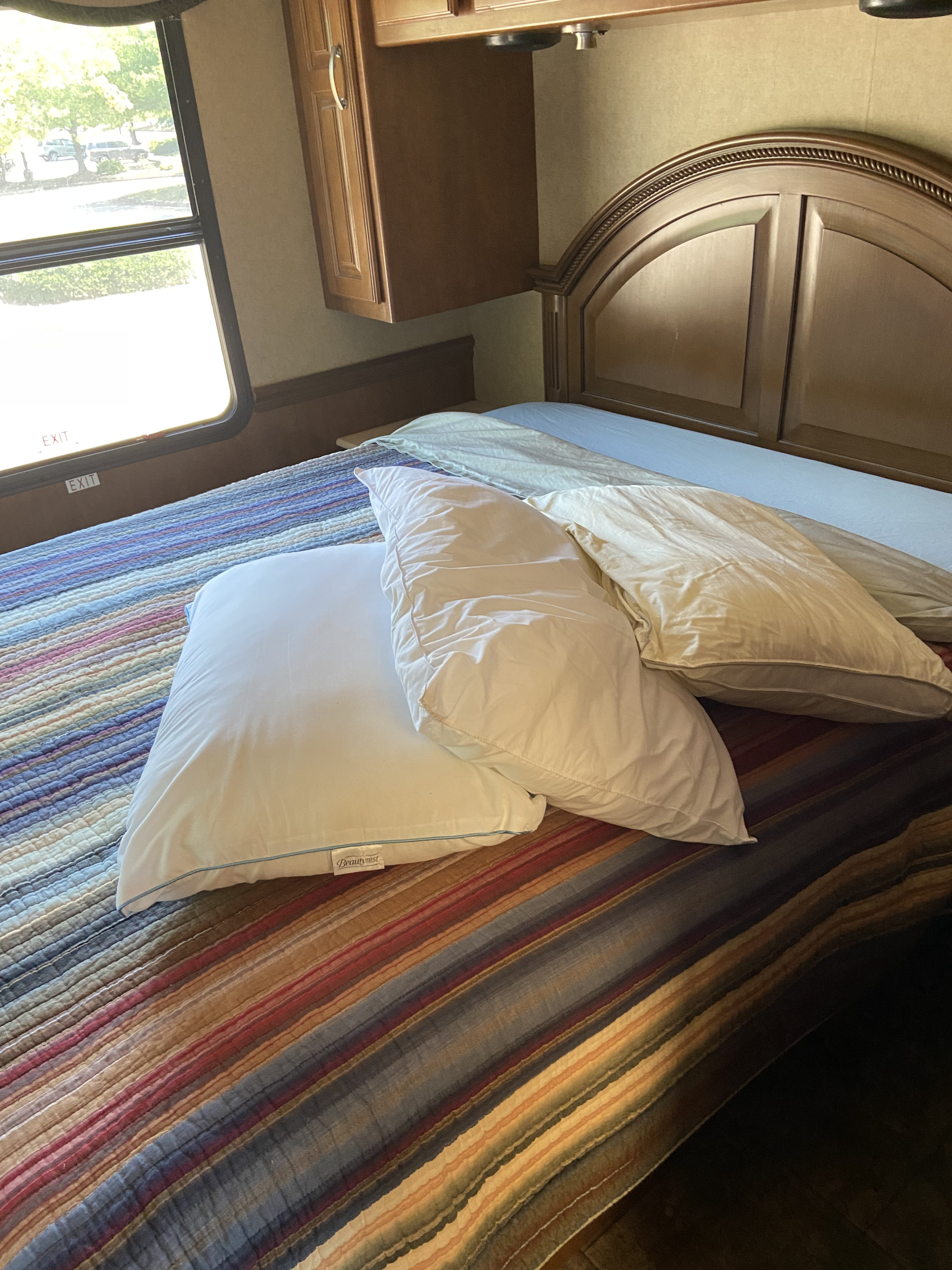 Master bed is a RV queen. Which mean just as wide as a queen but a bit shorter. I am 6'1" and it is fine.. Thor Challenger 2015