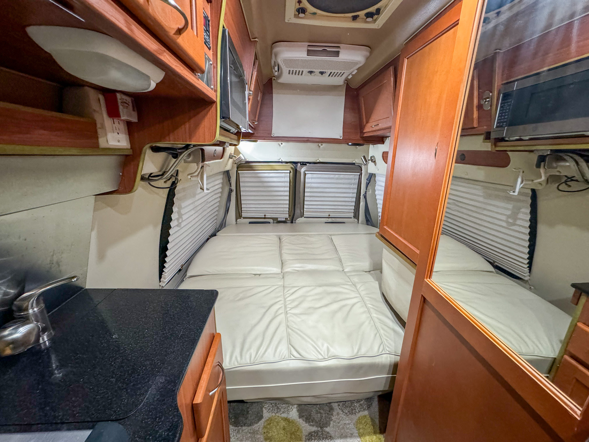 Electronically controlled couch unfolds into bed with a push of a button. Great West Vans Great West Vans Class B 2010