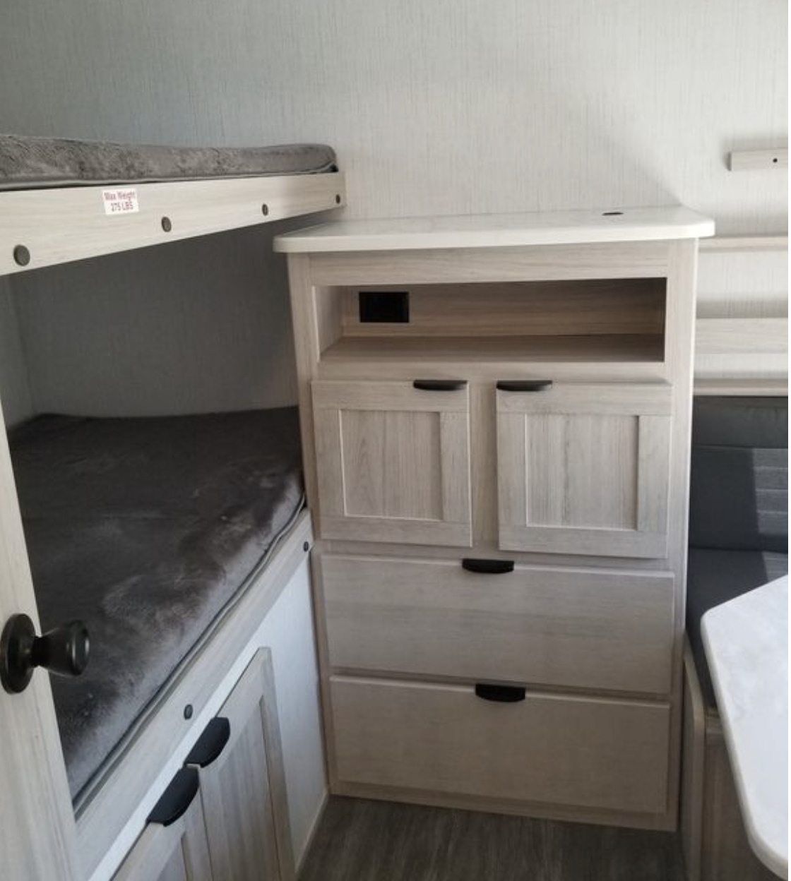 RV rental interior with light wood bunk beds and ample storage cabinetry, ideal for families.. Cruiser RV Shadow Cruiser 2023