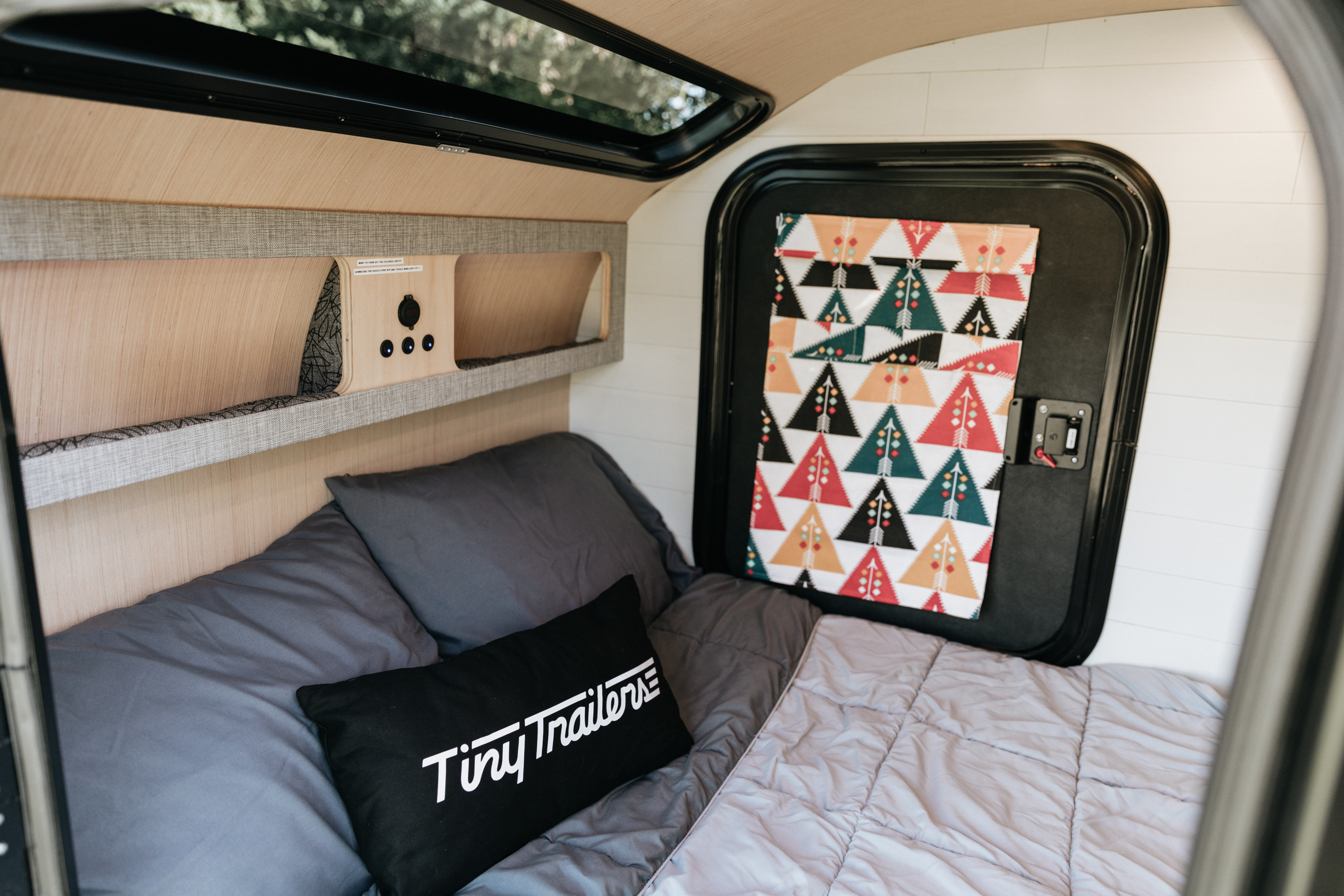 Full size matress for cozy sleeping arrangements under a beautiful stargazer window!. WeGo Wander 2023