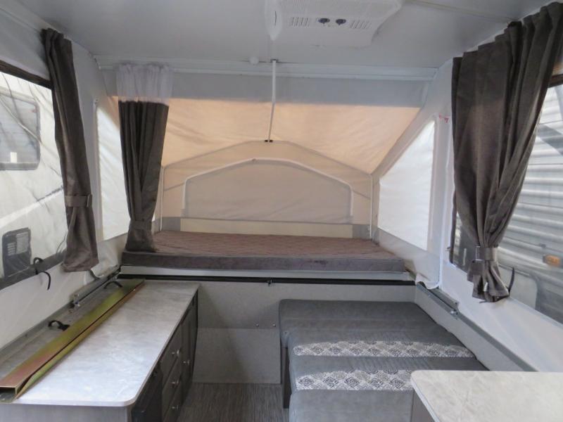 Inside this RV rental pop-up camper, you'll find two comfortable sleeping areas with mattresses, curtains, and a counter.. Forest River Flagstaff 2020