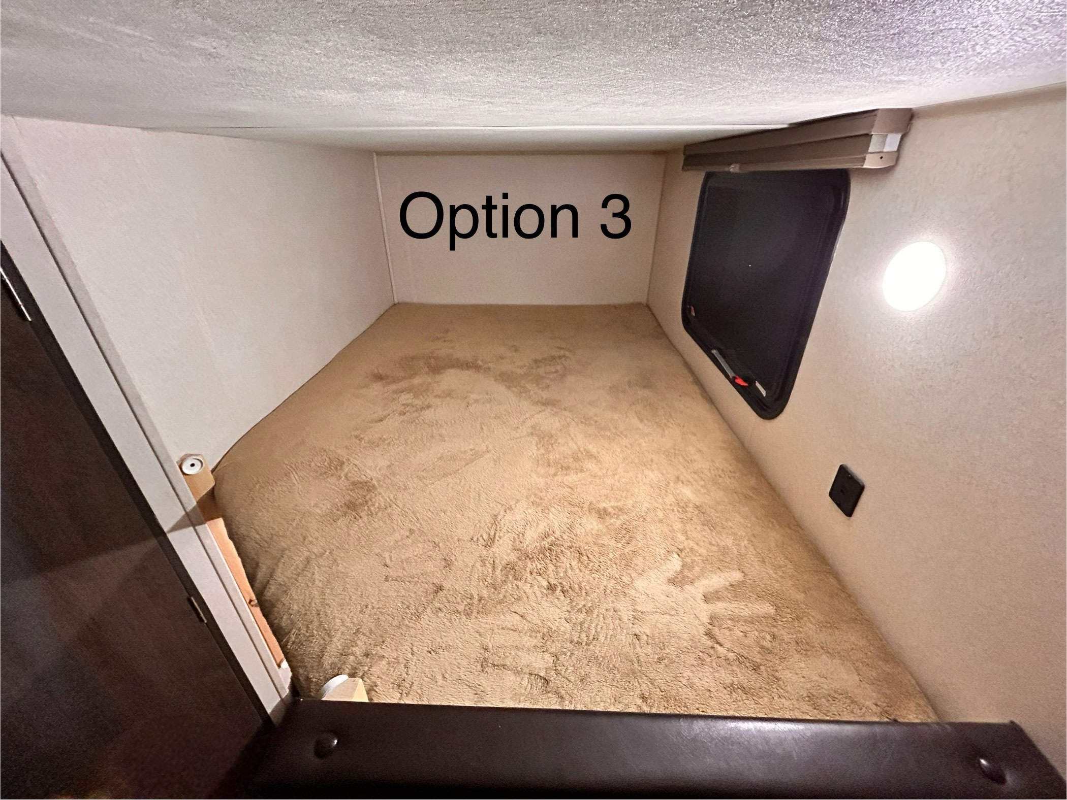 RV rental: cozy bunk with fluffy bed, window, and light. "Option 3" shown.. Forest River Wildwood X-Lite 2019