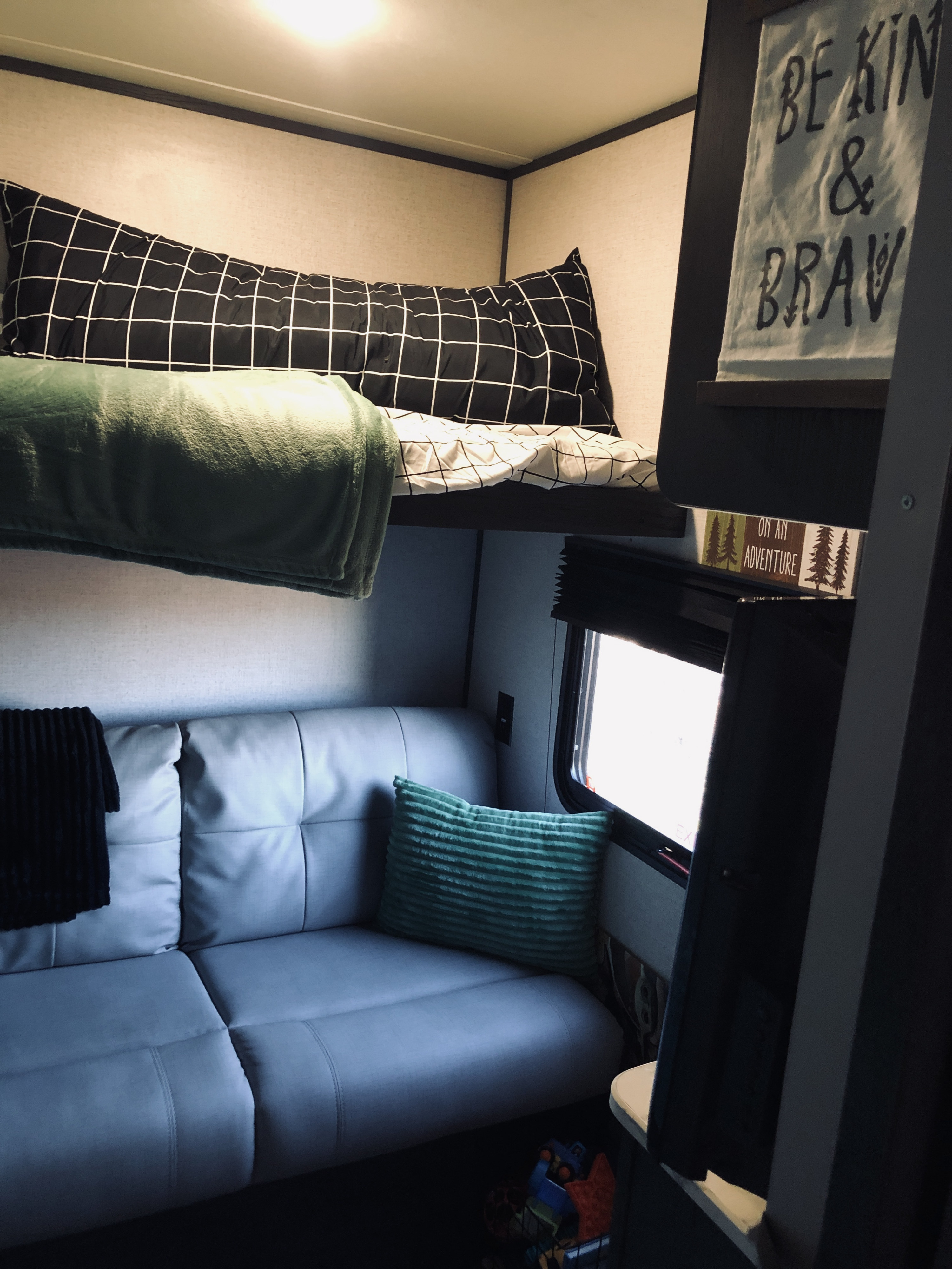 There are 3 twin bunks, as well as a small sofa, in the rear bunk area.. Aspen Trail LE 2021
