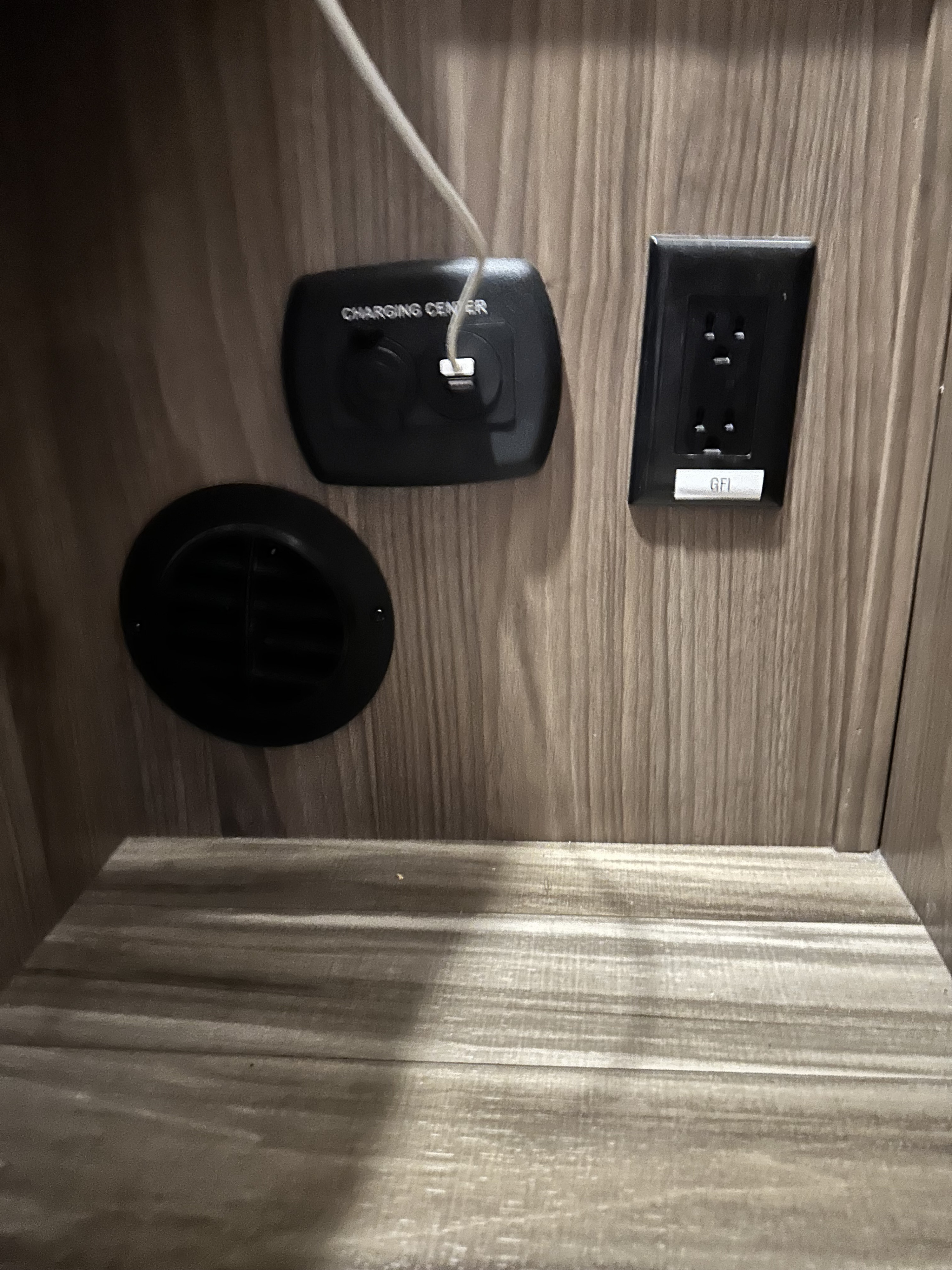 Charging ports next to queen bed and other outlets throughout the interior of the RV. Coachmen Freelander 26RS 2017