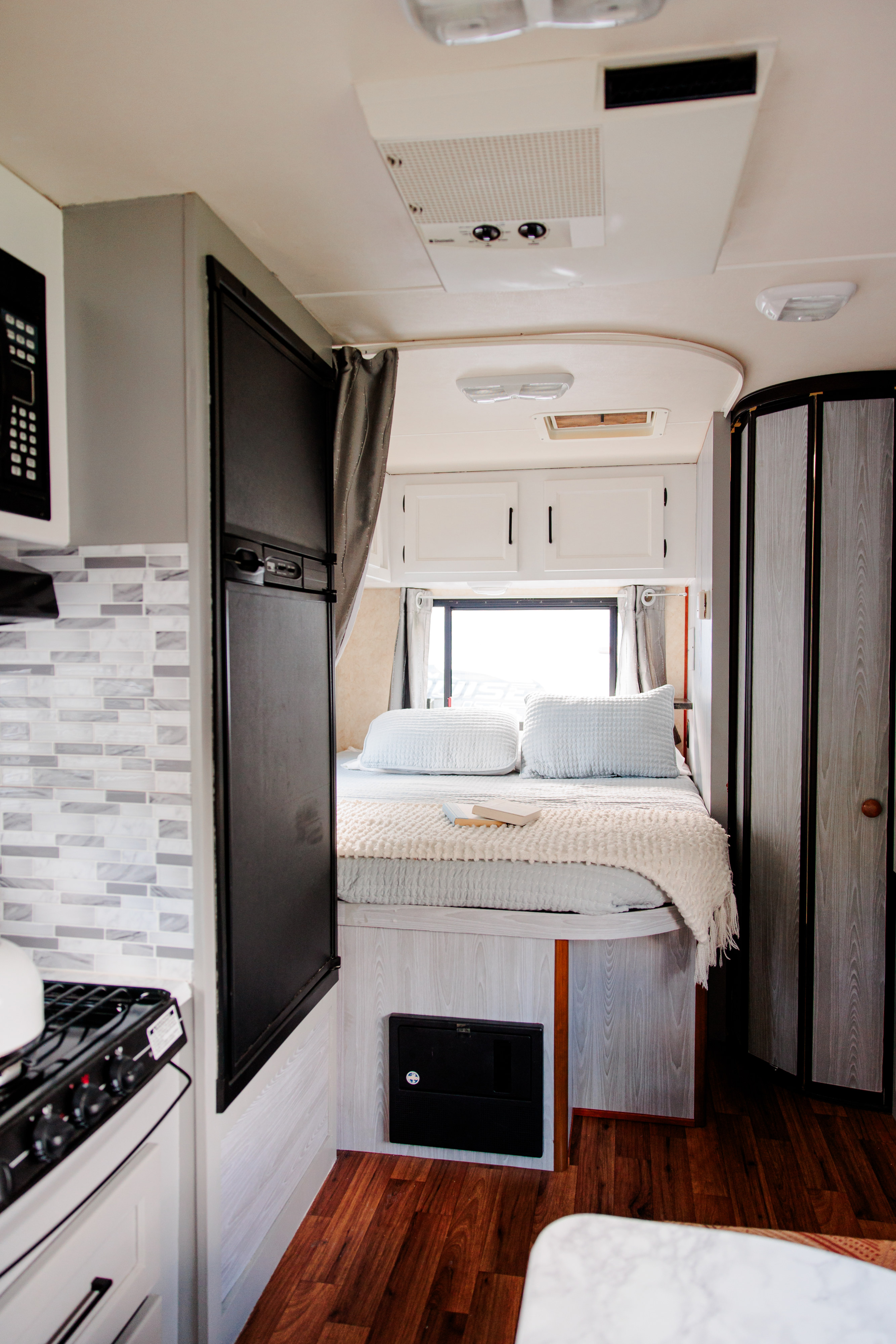 Step inside this RV rental's renovated interior, boasting a cozy bedroom, compact kitchen, and stylish finishes.. Forest River Coachmen Freelander 2012