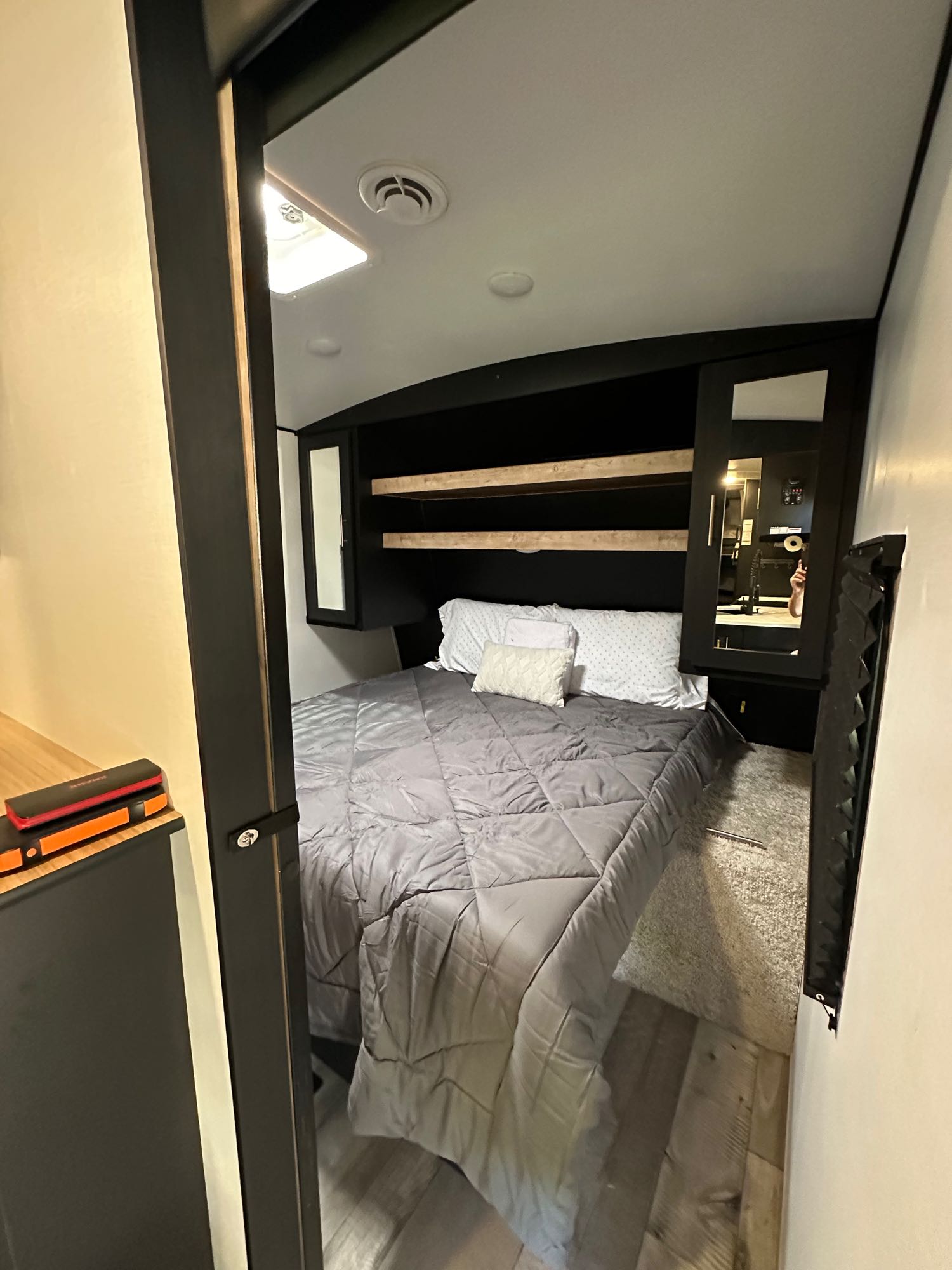Bedroom with Queen bed Two cabinet’s to hang clothes two shelves, foot of bed folds up for plenty of storage and access lid to the outside storage  . Keystone RV Springdale 2022