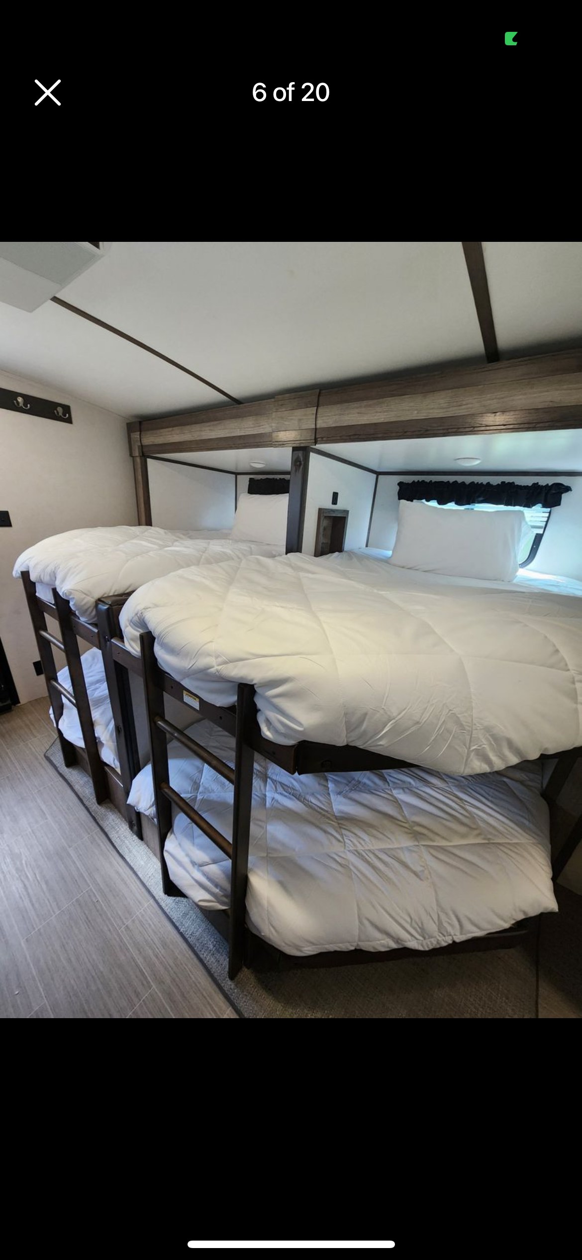 RV rental interior with multiple comfortable bunk beds & white bedding, great for family trips.. Keystone RV Passport GT 2021