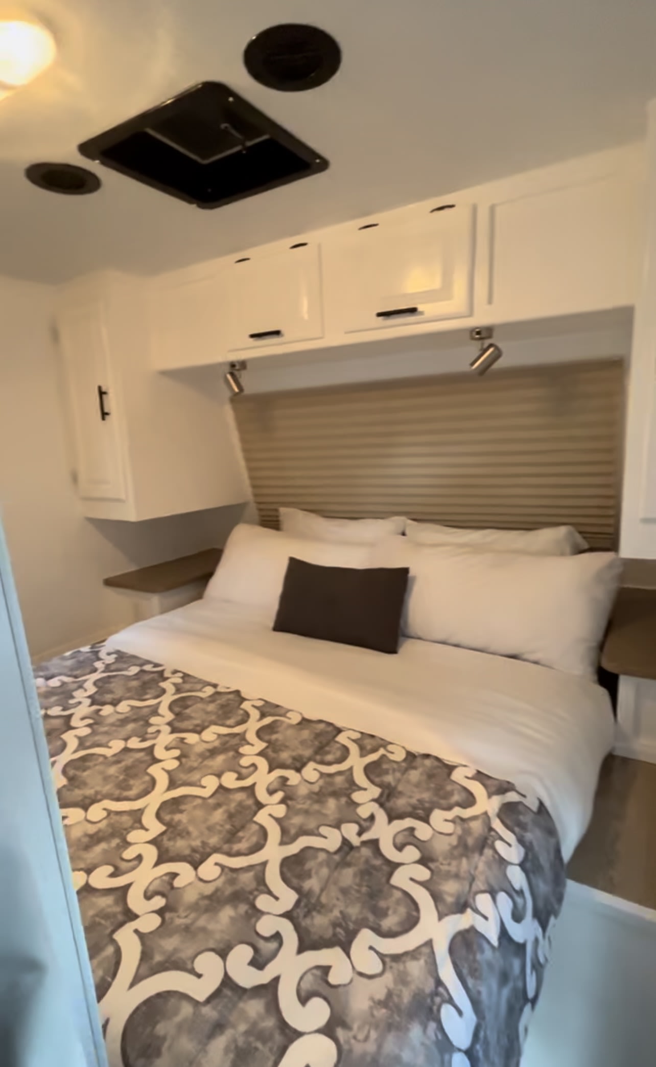 RV rental: Compact bedroom with a comfortable bed, white overhead storage, and ceiling vents.. Rockwood Elite light 2009