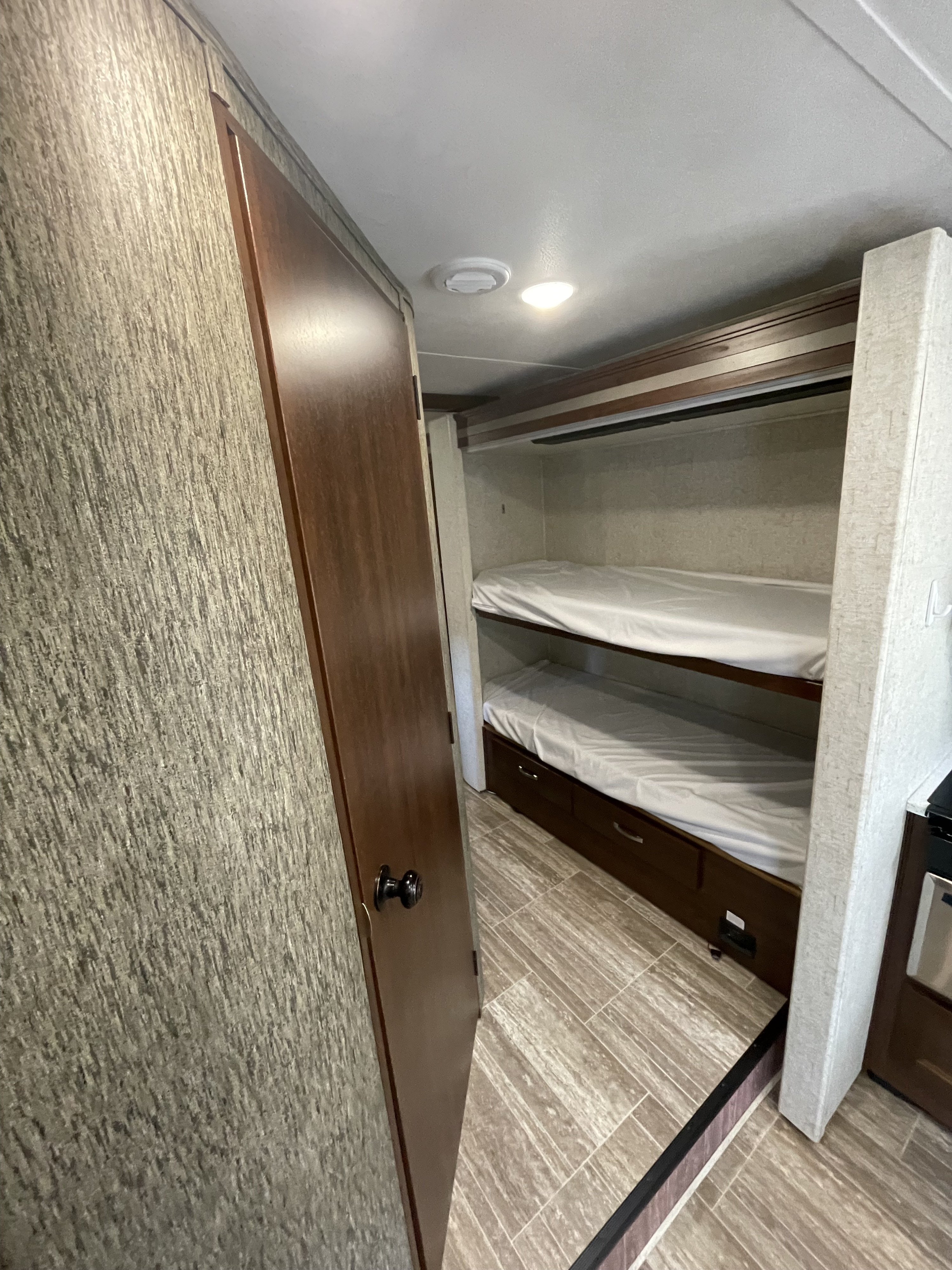 RV rental interior: cozy bunk beds with storage drawers, perfect for family travel.. Forester Forester Motorhome 2018