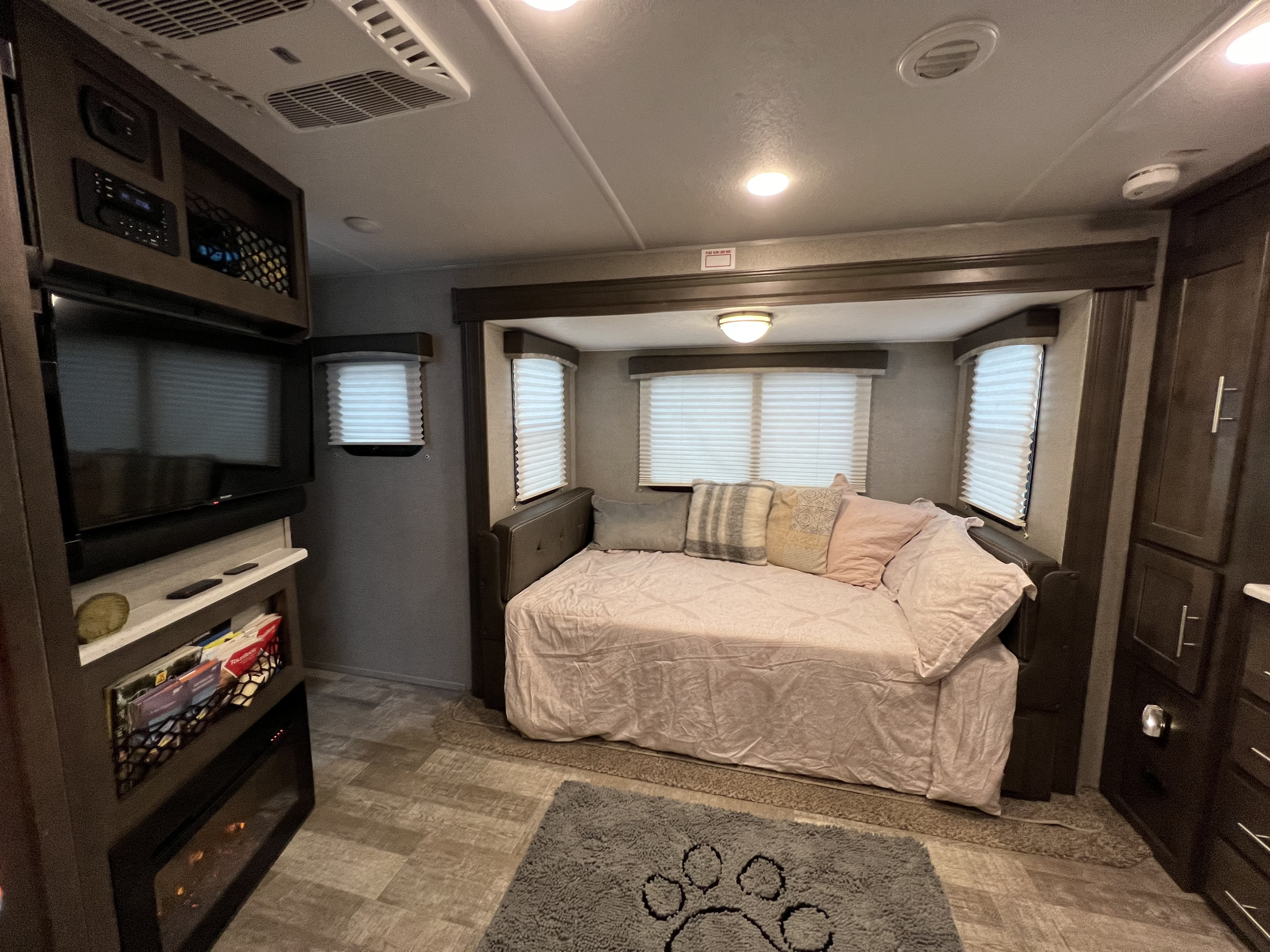 This inviting RV rental features a comfortable bed, TV, and cozy living space, perfect for your next adventure.. Forest River Rockwood Mini Lite 2021