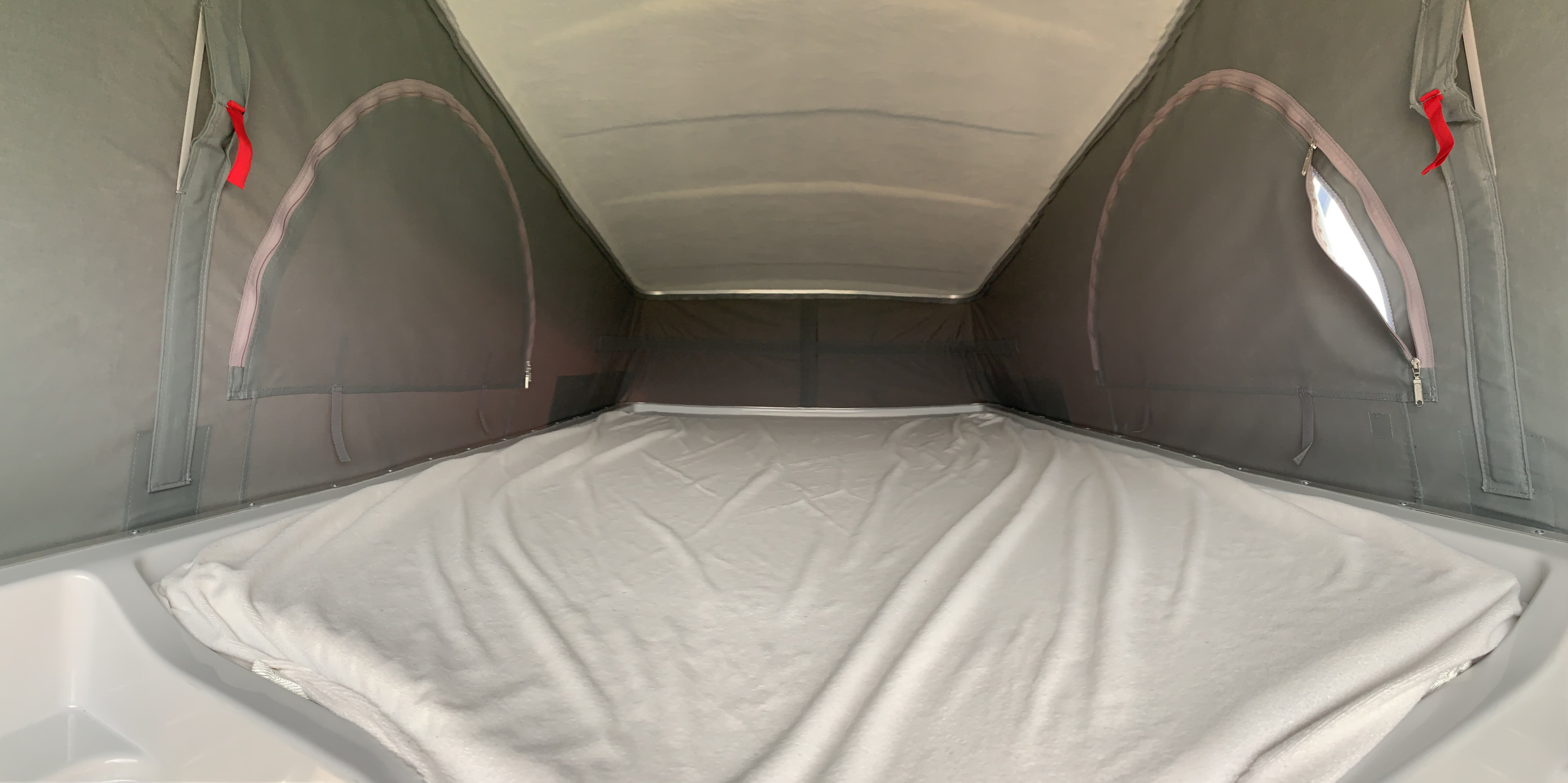 Cozy RV rental pop-top sleeping area with soft bedding, ideal for comfortable road trip adventures and a great night's sleep.. BURSTNER Campeo 2026