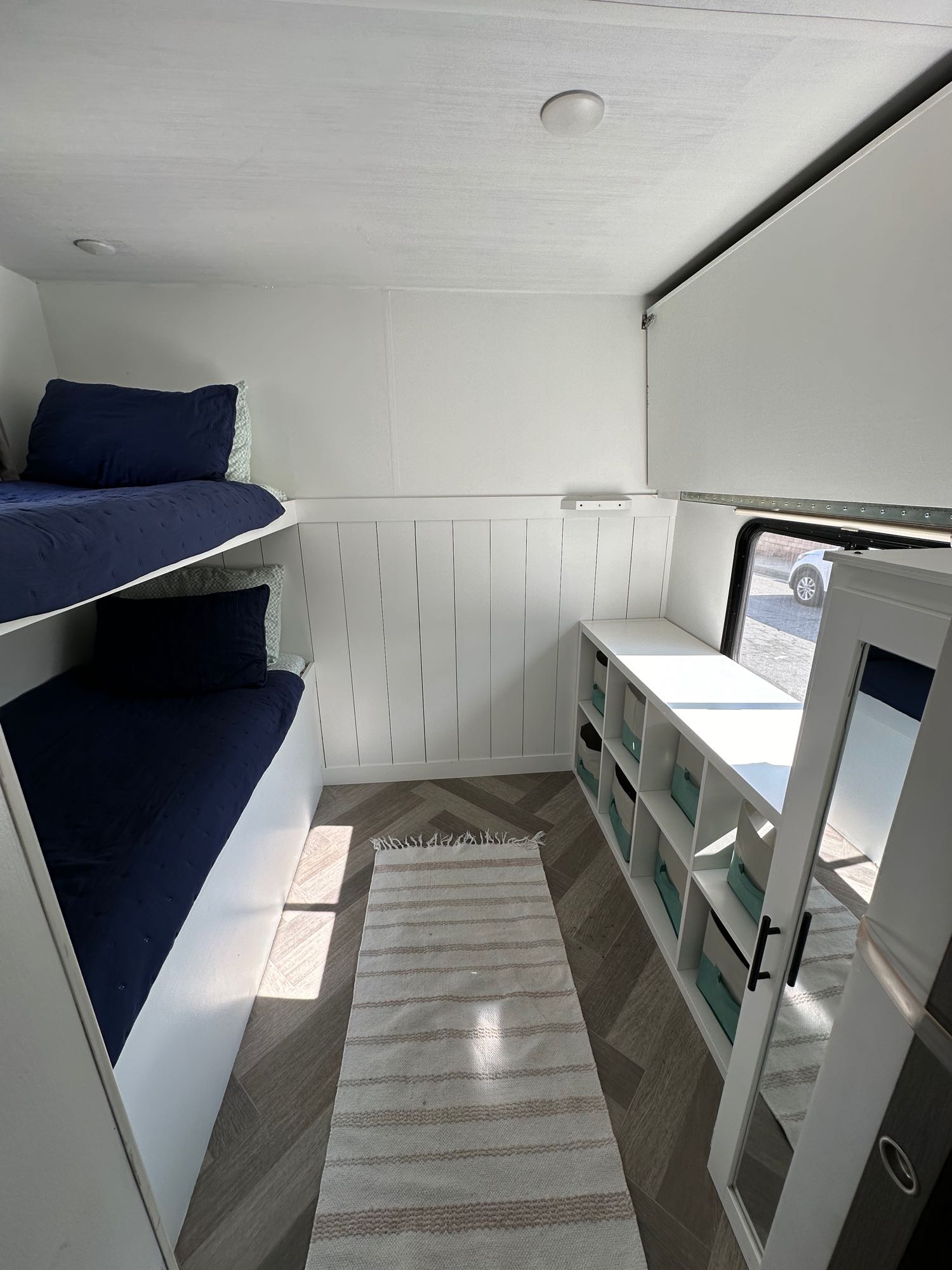 Cozy RV rental interior featuring bunk beds, smart storage, and a modern design. Ideal for travel accommodation.. Forest River Salem 2021