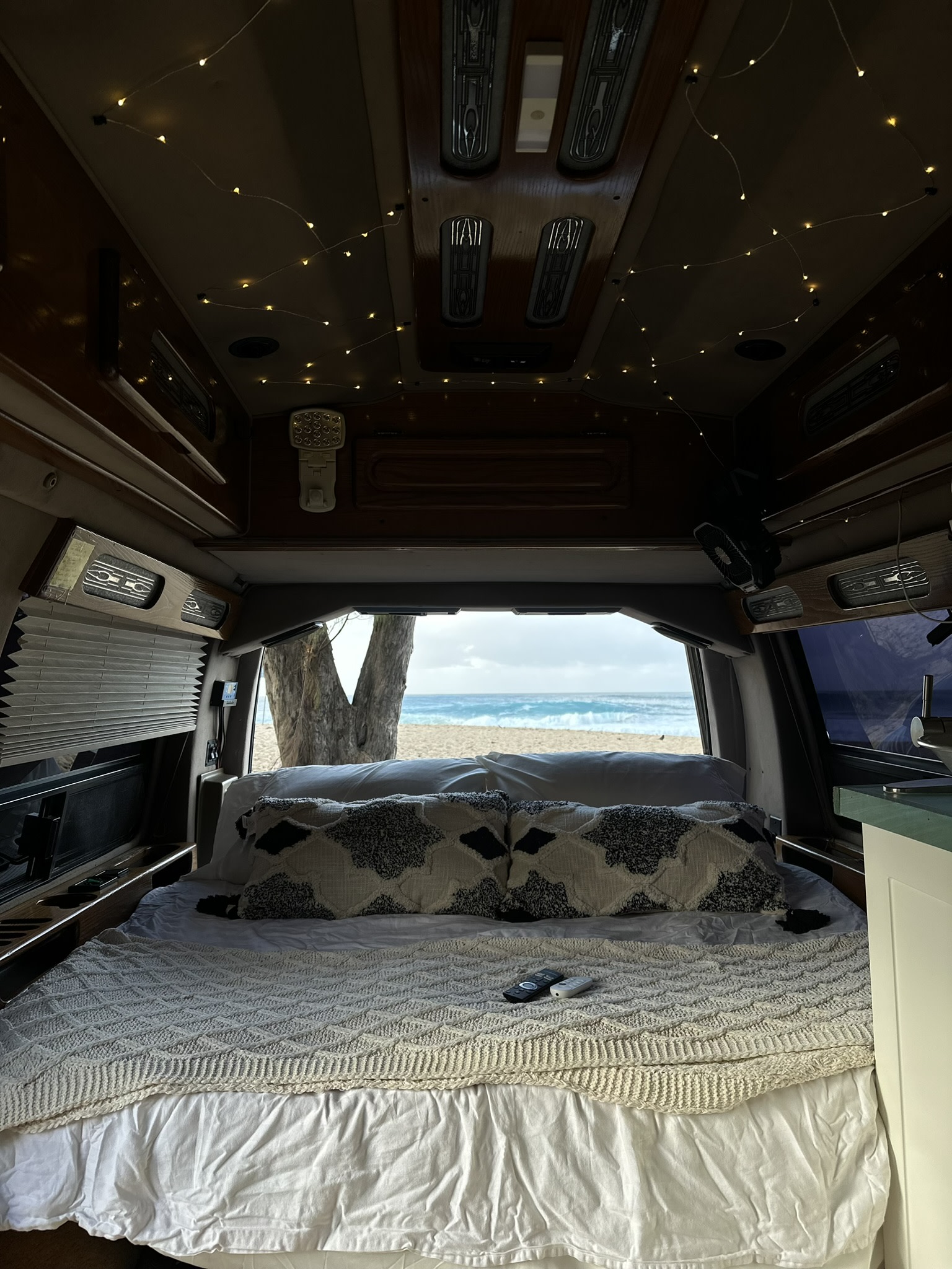 Experience van life: This RV rental features a cozy bed with ambient lights and an incredible beach view.. Chevrolet Express 1997